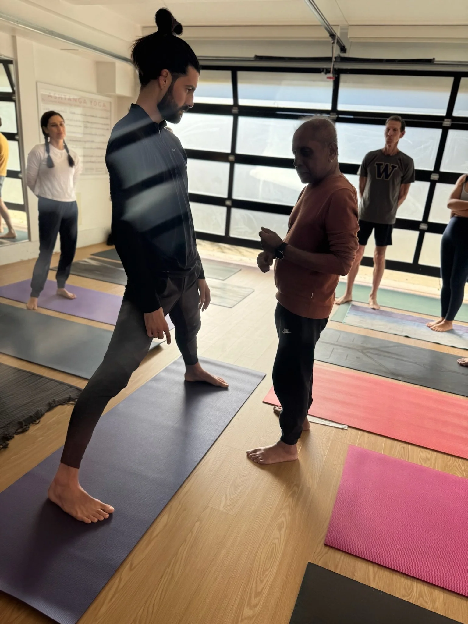 Manju P. Jois sharing his wisdom on Prasarita Padottanasana yoga therapy assists