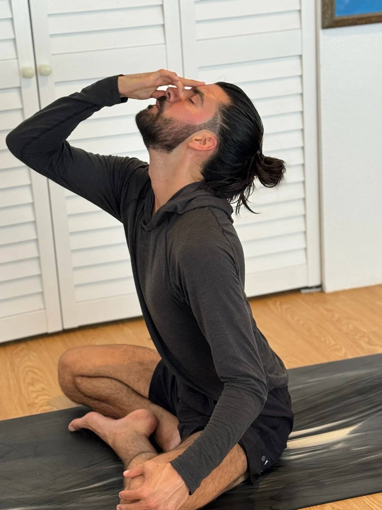 Caio practicing nadi shodhana pranayama in Encinitas, California