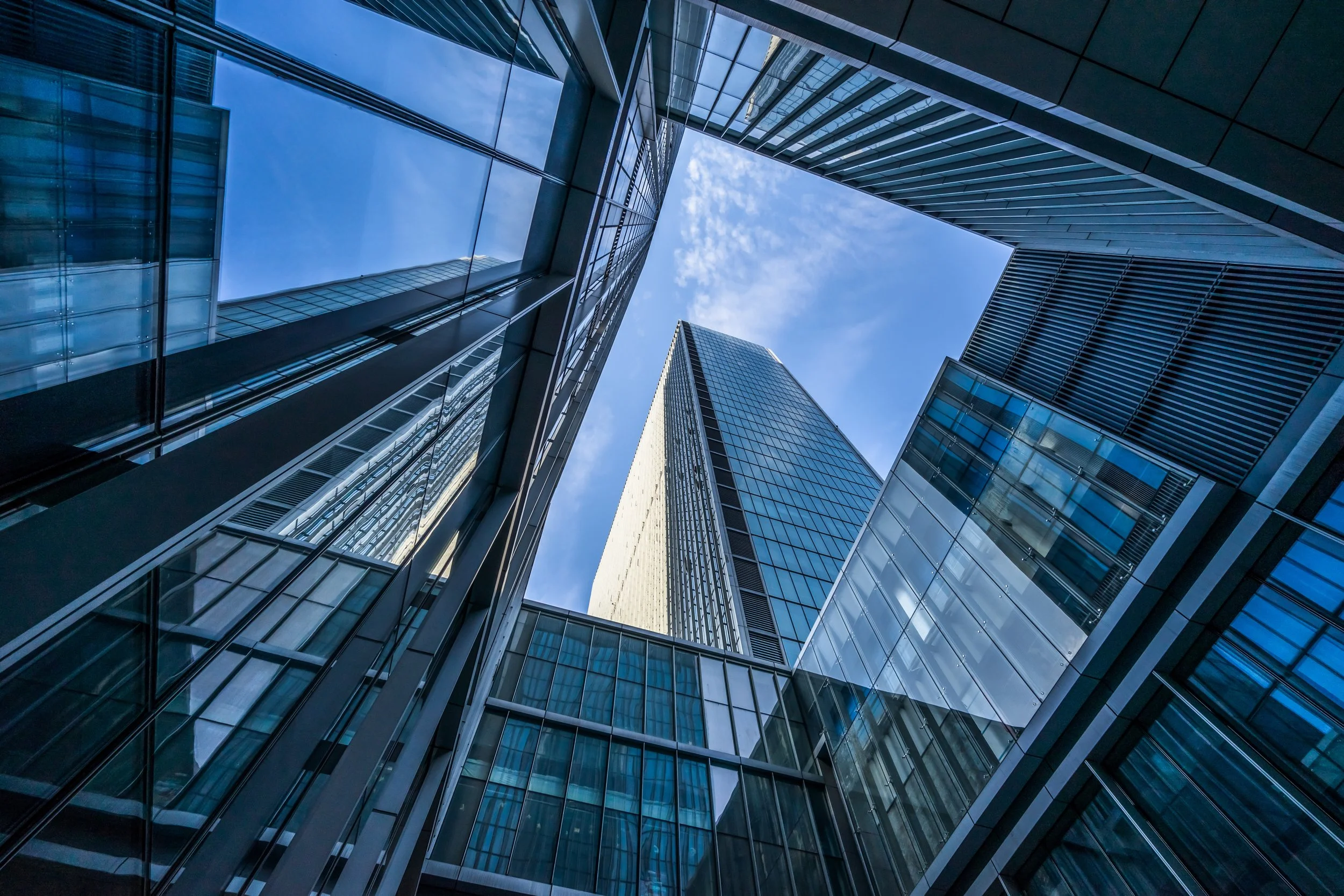 Glass office towers viewed from street level