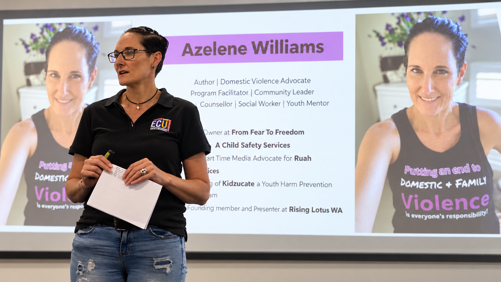 Woman wearing glasses and a black polo shirt standing in front of a presentation slide about Azelene Williams, with large photos of her on either side of the slide.