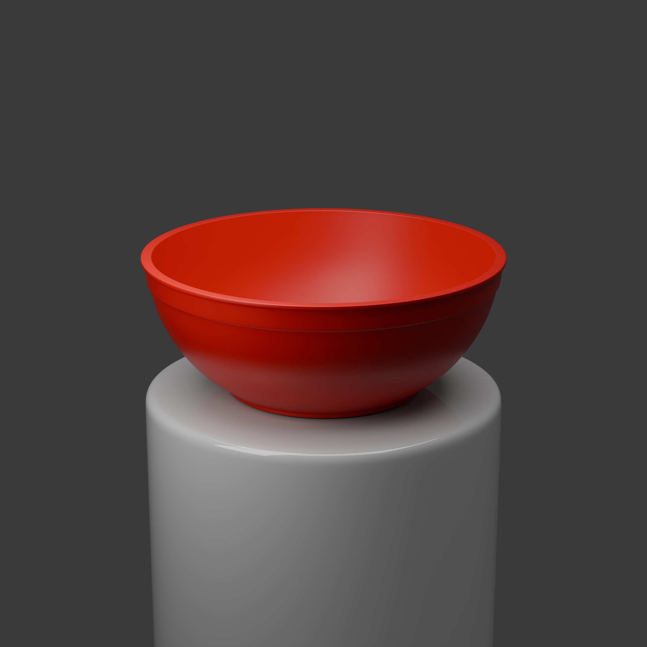 Red bowl placed on a white pedestal against a dark gray background.