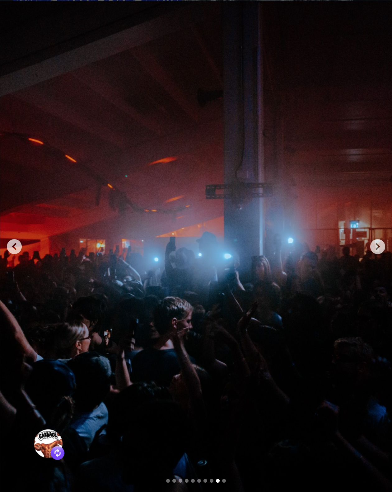 Crowd dancing and enjoying music at a concert with stage lights and fog effects.