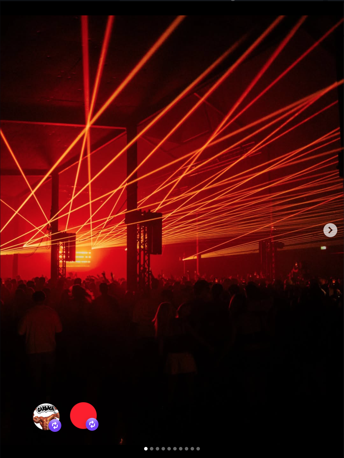 Concert or nightclub scene with red laser lights and a crowd of people.
