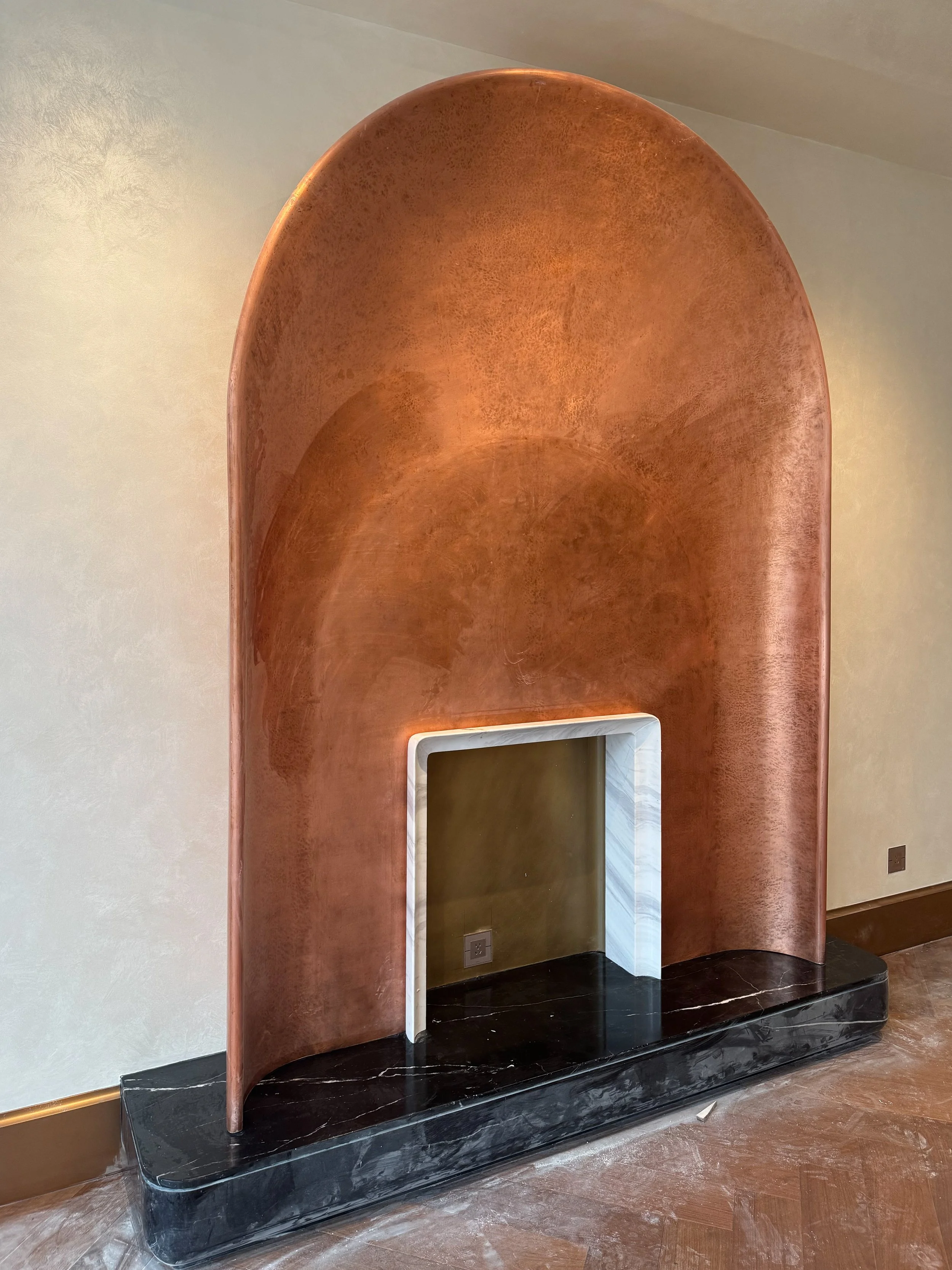 Copper skinned fireplace installed