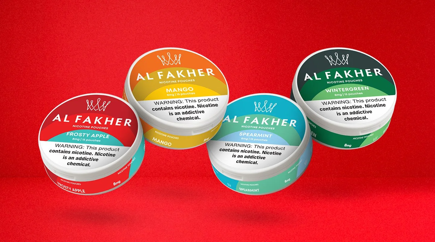 Al Fakher Nicotine Pouches flavor range featuring Frosty Apple, Mango, Spearmint, and Wintergreen cans.