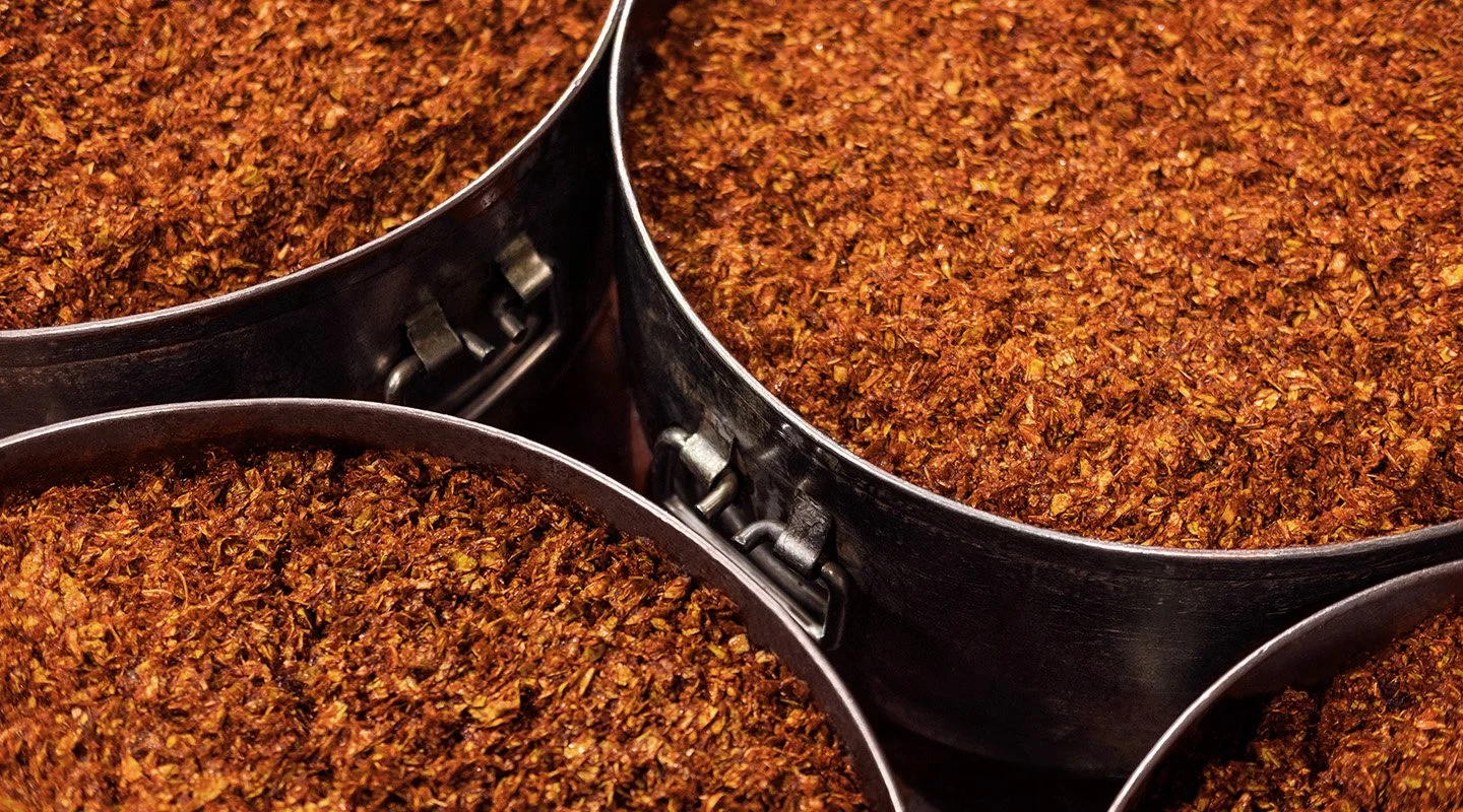 Freshly prepared shisha tobacco blends stored in containers to preserve flavour and consistency.