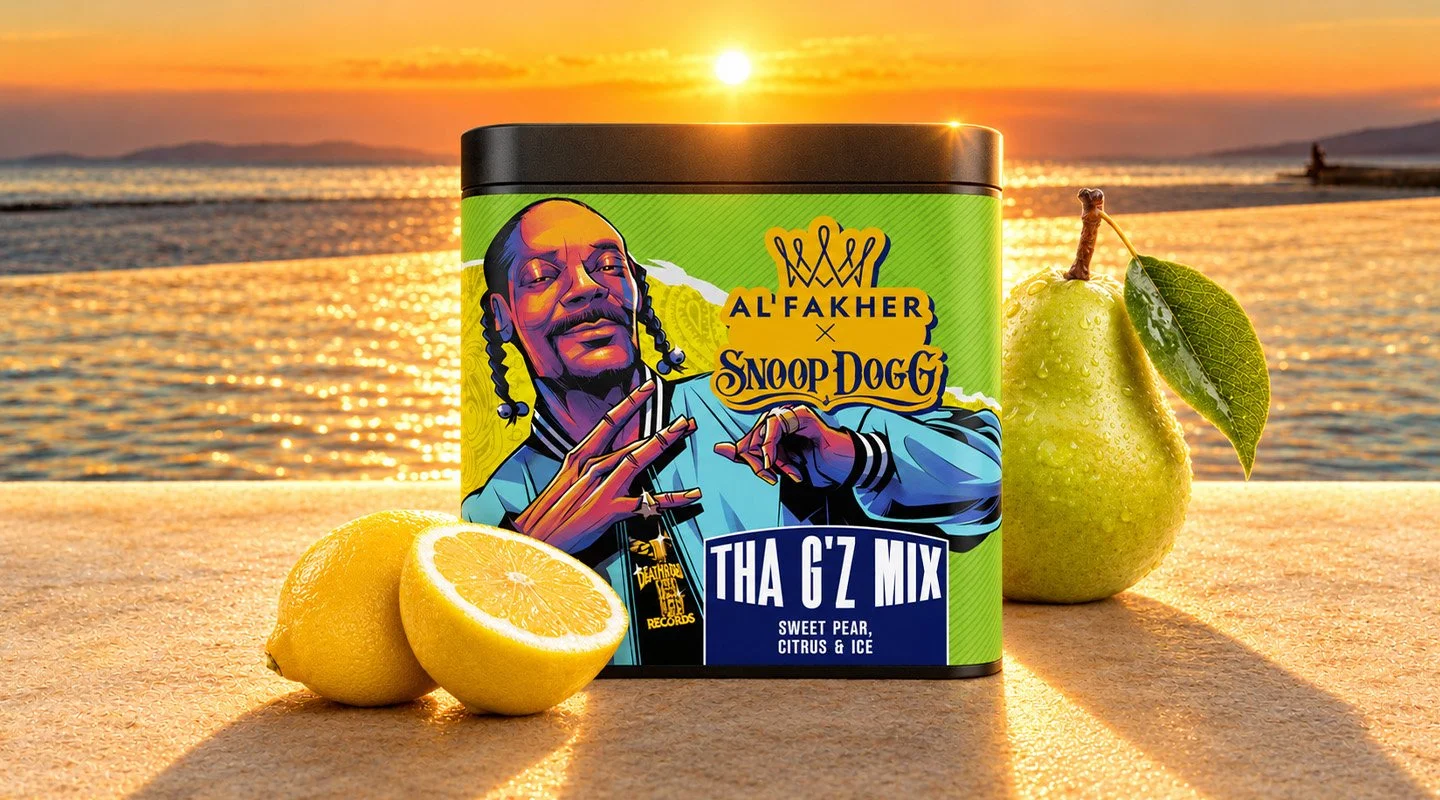 Al Fakher x Snoop Dogg Tha G'z Mix shisha tobacco tub with fresh pear and lemon on a sunlit seaside surface.