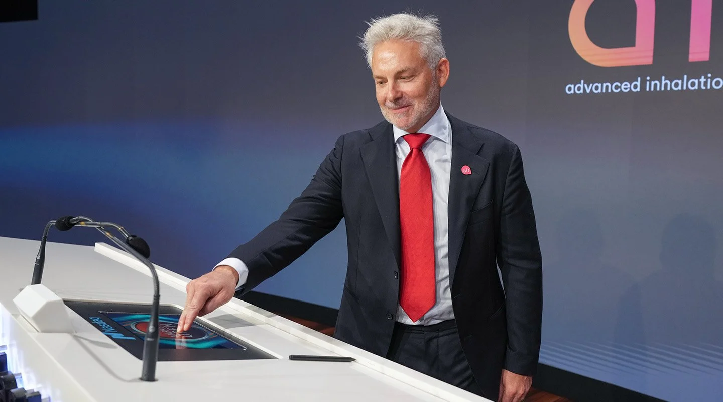 AIR CEO, Stuart Brazier presses the Nasdaq opening bell button during the company’s public listing celebration.