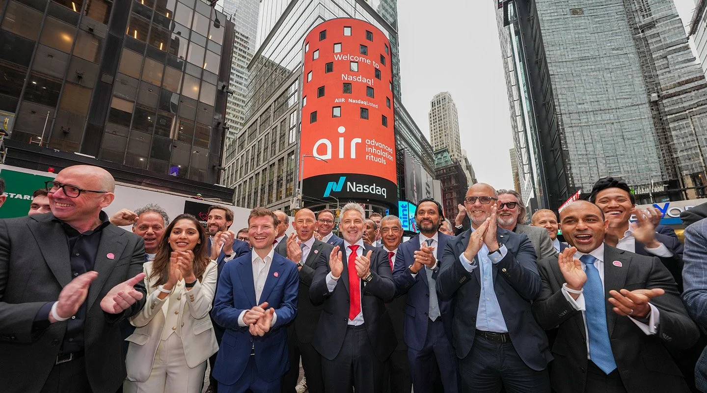 AIR executives, employees and partners gather at the Nasdaq MarketSite to mark the company’s public listing.