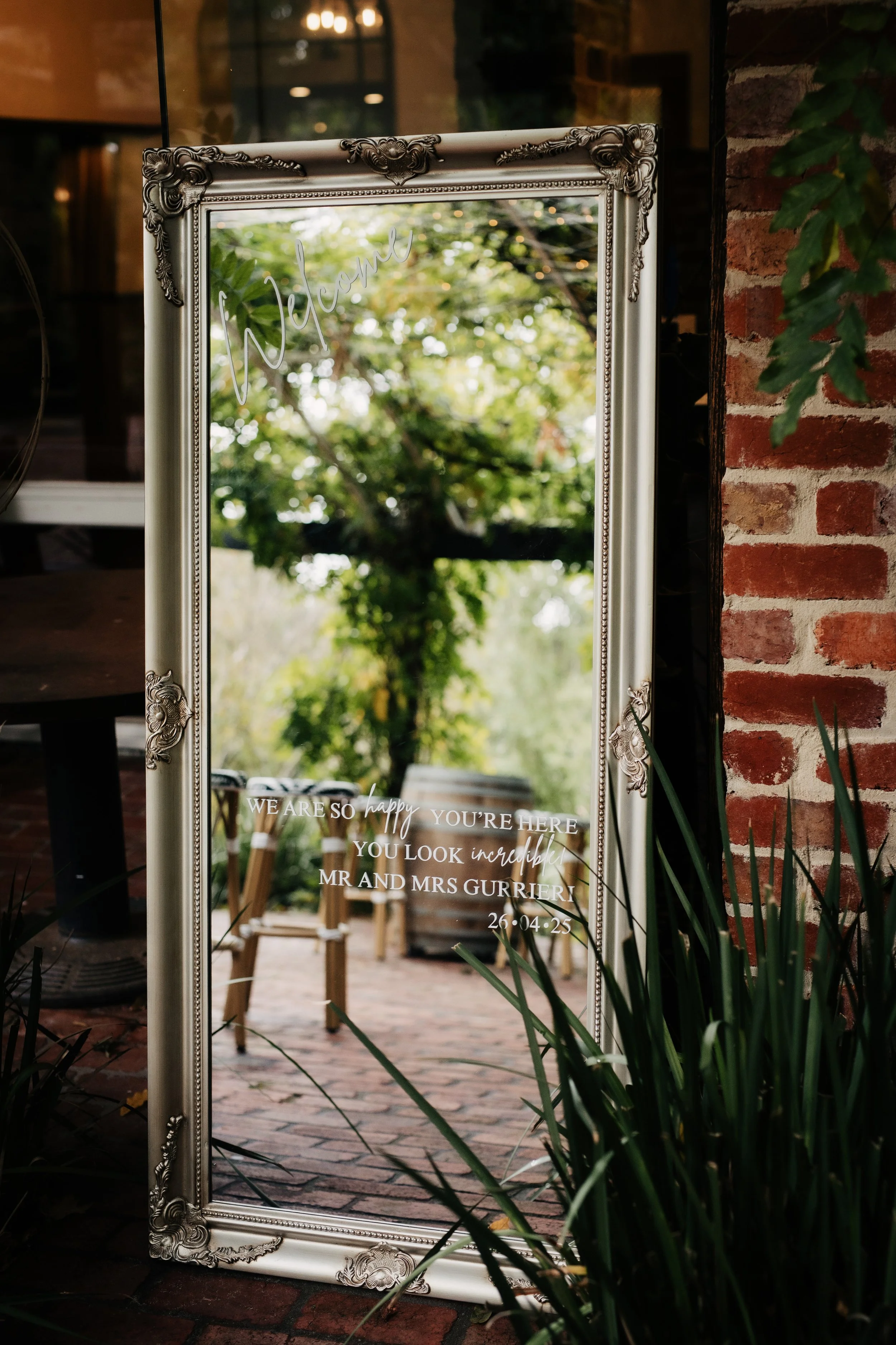 Mirror welcome sign with couples name and date