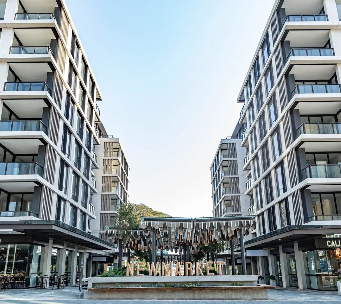 Modern apartment buildings with Newmarket sign