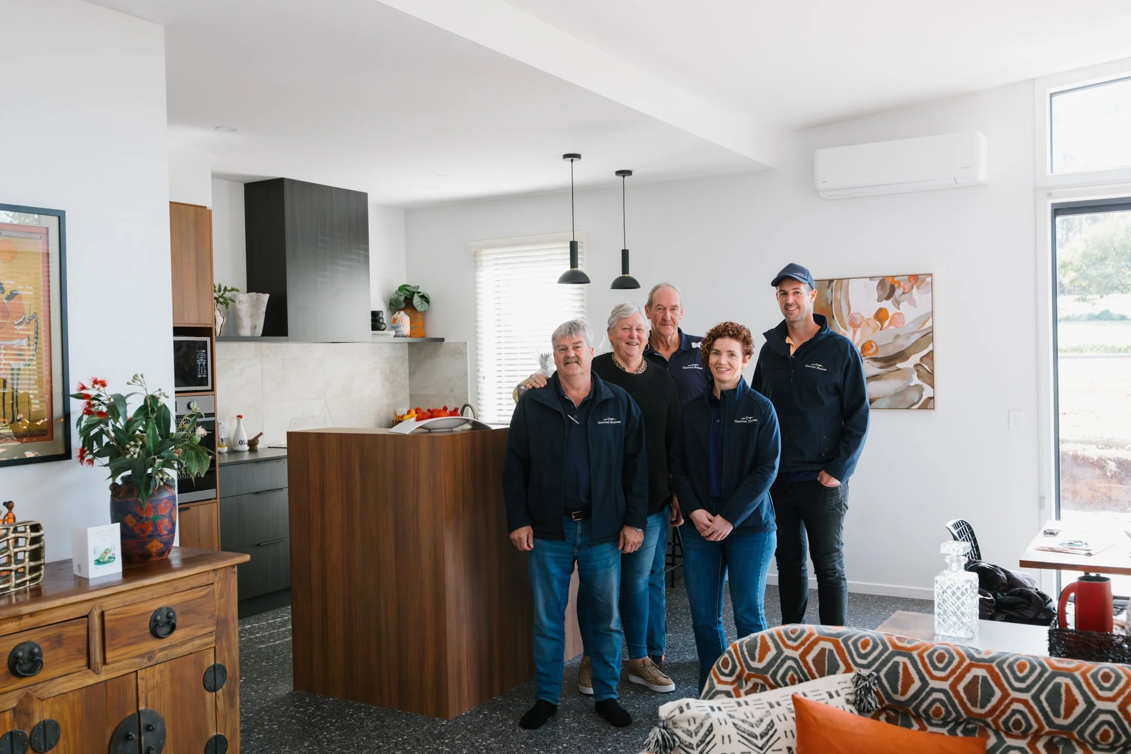 Garron Homes Team Photo in Modern Open Living and Kitchen
