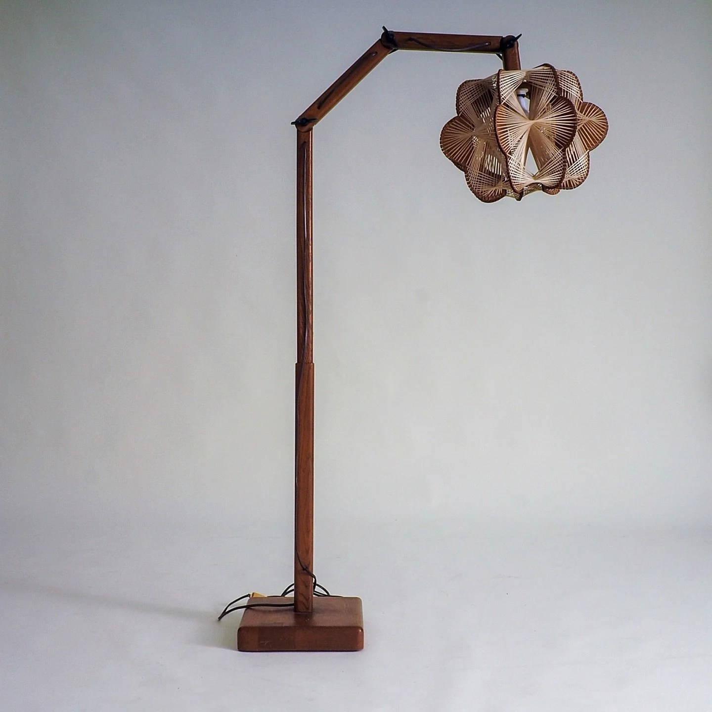 Vintage Danish Floor Lamp with Woven Shade

Beautiful vintage Danish floor lamp from the 1960s/1970s The lamp features an adjustable arm with butterfly screws, allowing for versatile positioning. The most captivating element of this floor lamp is it&