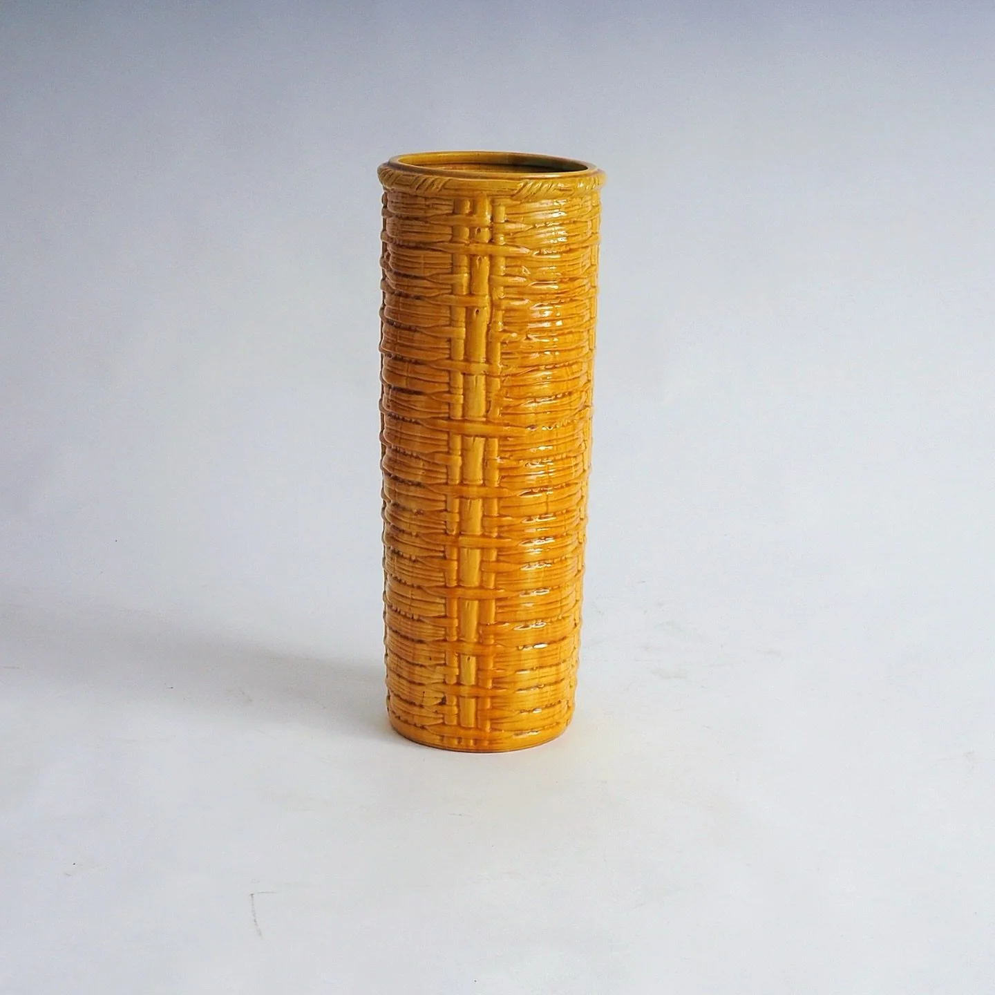 something to brighten up the dark days 💛

Striking extra large vintage ceramic vase in a bright yellow colour and a woven like pattern. 
The vase can also be use as an umbrella stand. 
It is in excellent vintage condition.

Measurements: H 65 x D 24