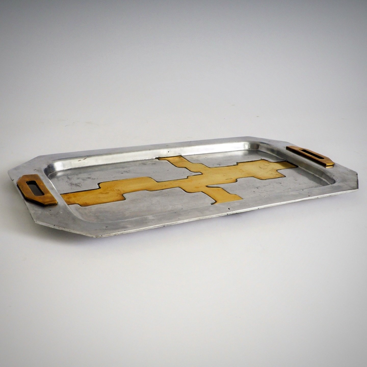 Brutalist Tray by David Marshall 

This tray is a quintessential example of the Brutalist metalwork of David Marshall, a Scottish-born sculptor who established his workshop in southern Spain in the 1970s. 

His work is highly regarded for its &ldquo;