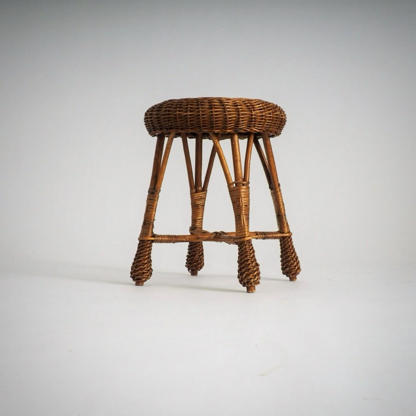 Vintage Rattan &amp; Wicker Stool &ndash; Plant Stand

Beautifully crafted rattan stool. Ideal when you&rsquo;re looking for a unique side table to hold your morning coffee or a lightweight seat for an extra guest.

The stool features a solid four-le