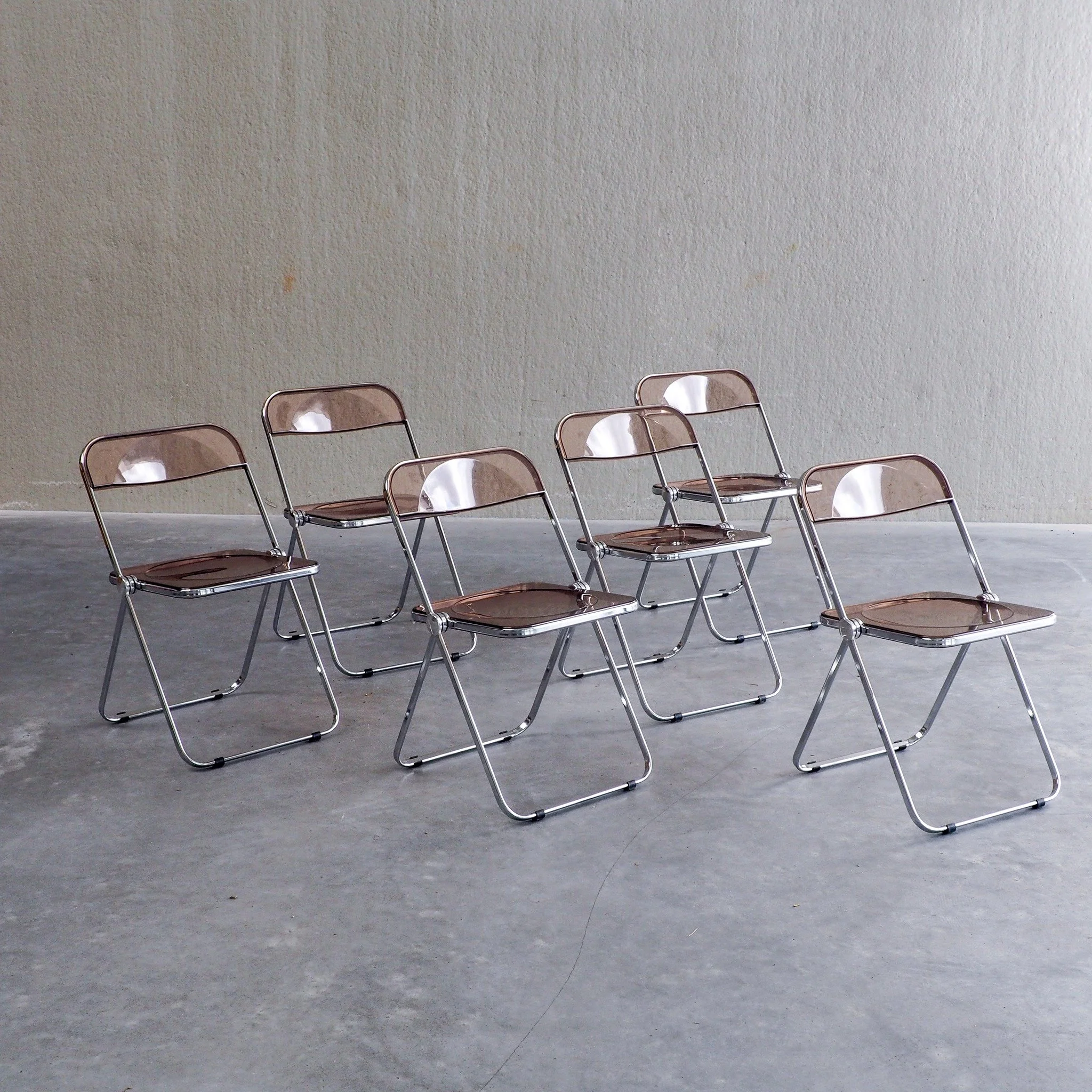 6 Plia Folding Chairs by Giancarlo Piretti for Anonima Castelli

Set of six Plia folding chairs, designed by Giancarlo Piretti for Anonima Castelli in 1967. A masterpiece of 20th-century Italian modernism, these iconic chairs feature polished chrome 