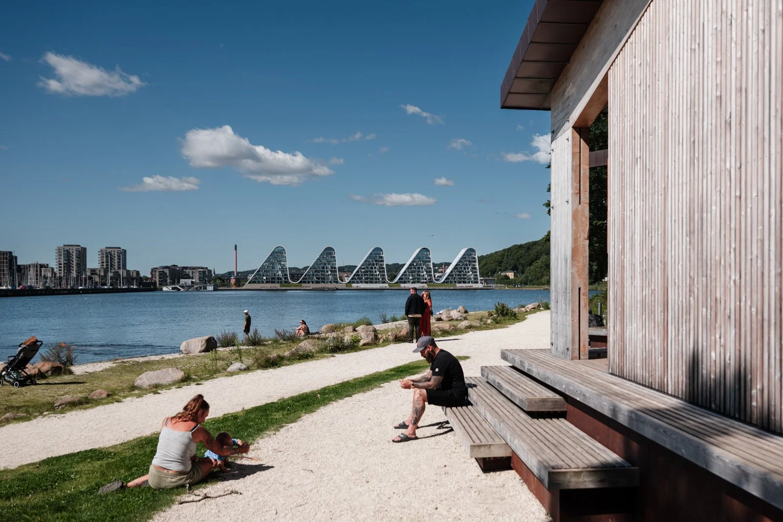 A sheltered space in the foreground contrasts with the open rhythm of $\text{The Wave}$ in the mid-distance.