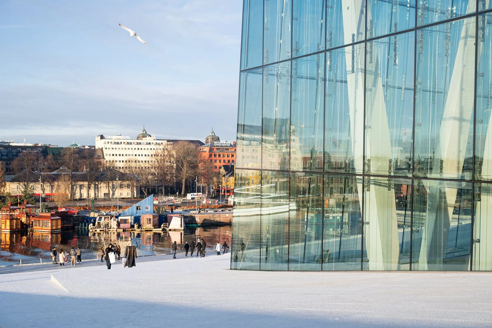 The exterior features expansive glass facades, ensuring abundant natural light penetrates the internal spaces.