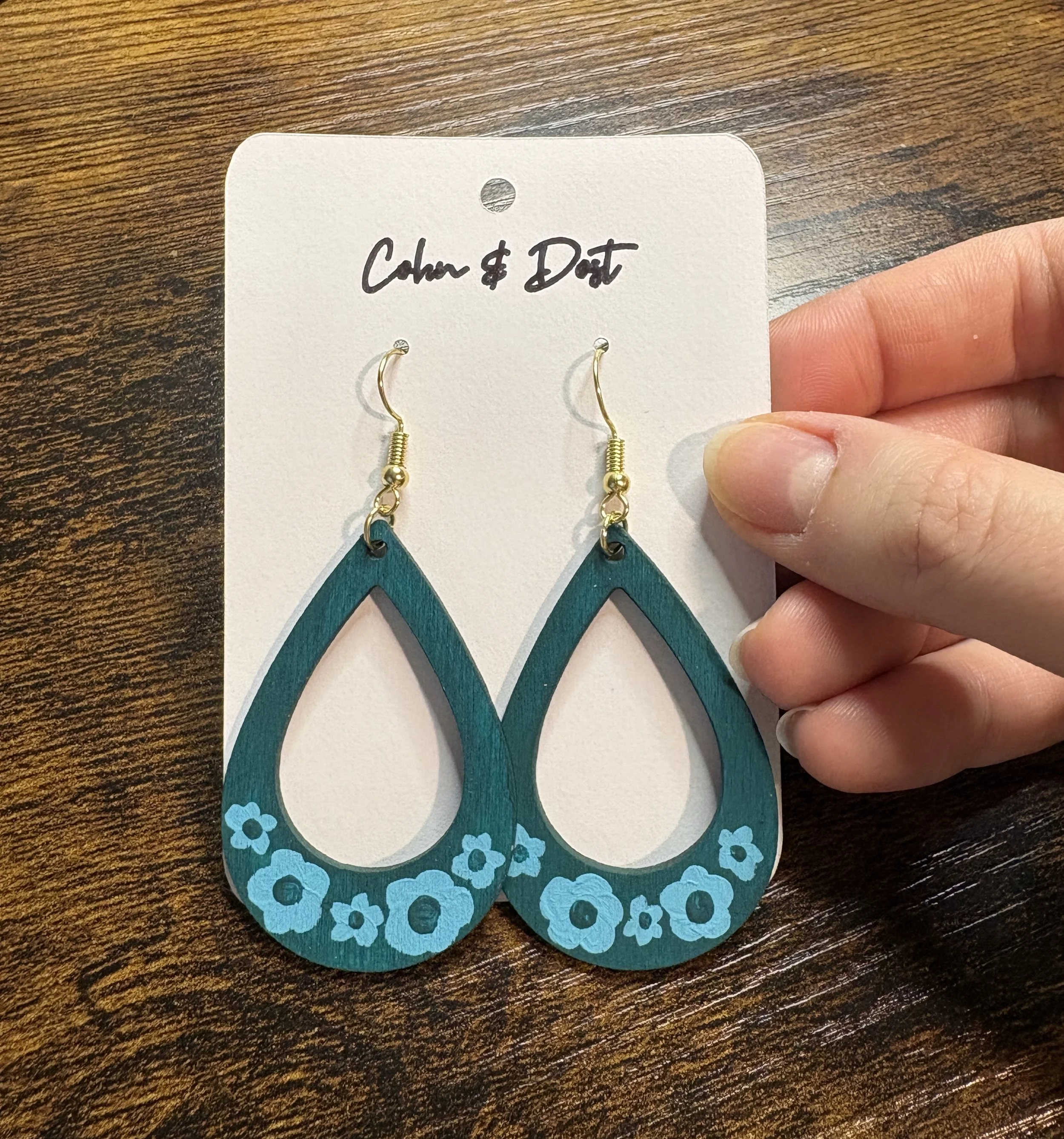 teal teardrop earrings holding.JPG