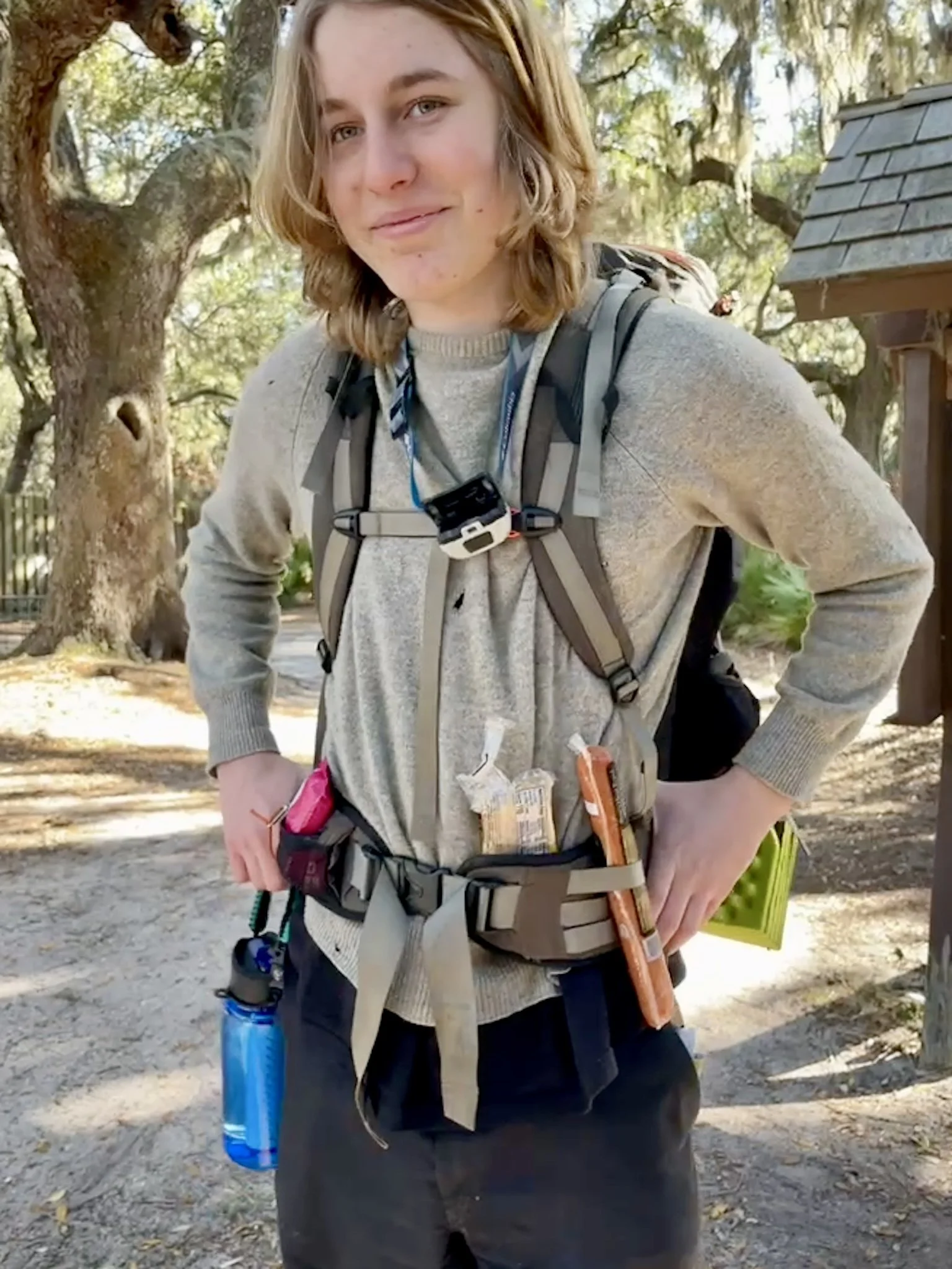 A teen wears his backpack showing he is ready for adventure at an outdoor screen-free backpacking camp.