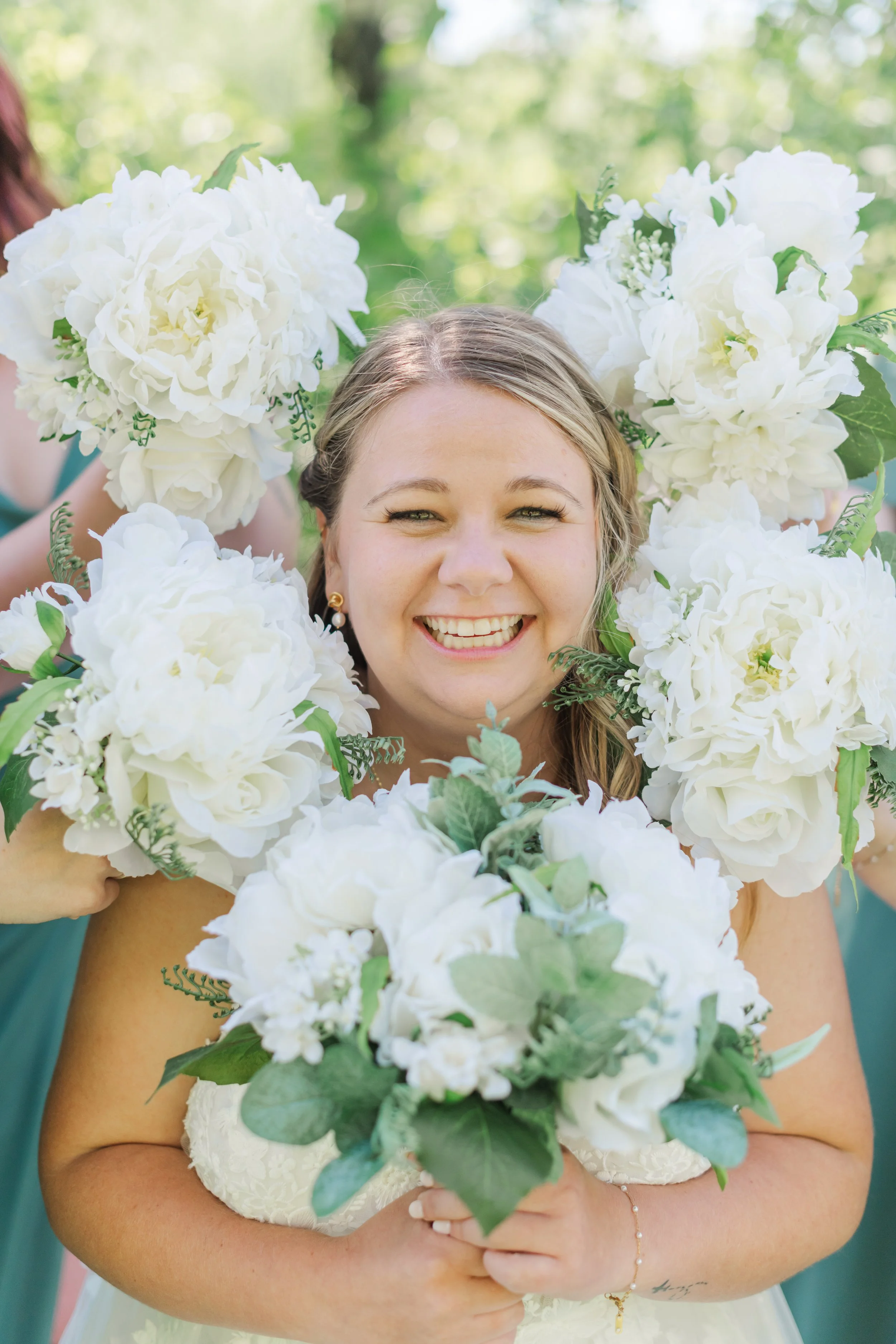  Bride surrounded by her bridesmaids bouquet.  