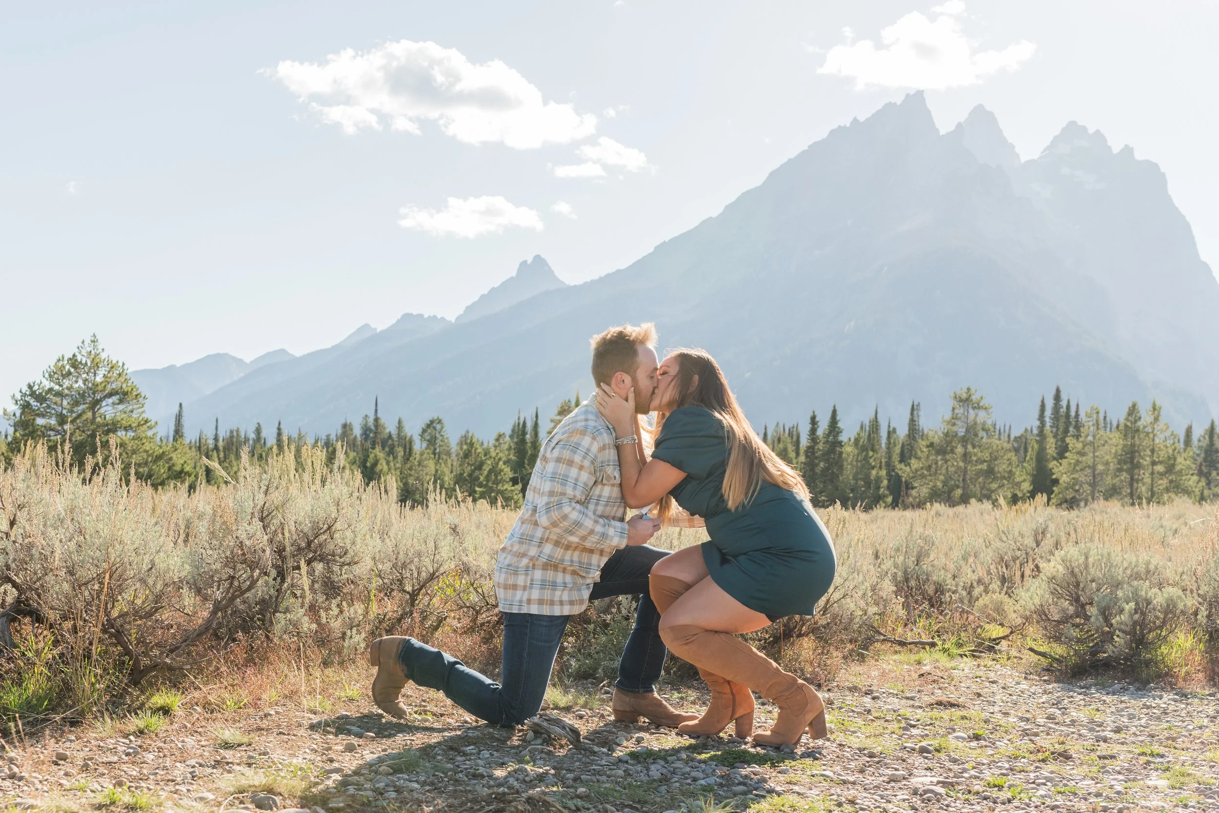 Couple Kissing in front of the Mountains