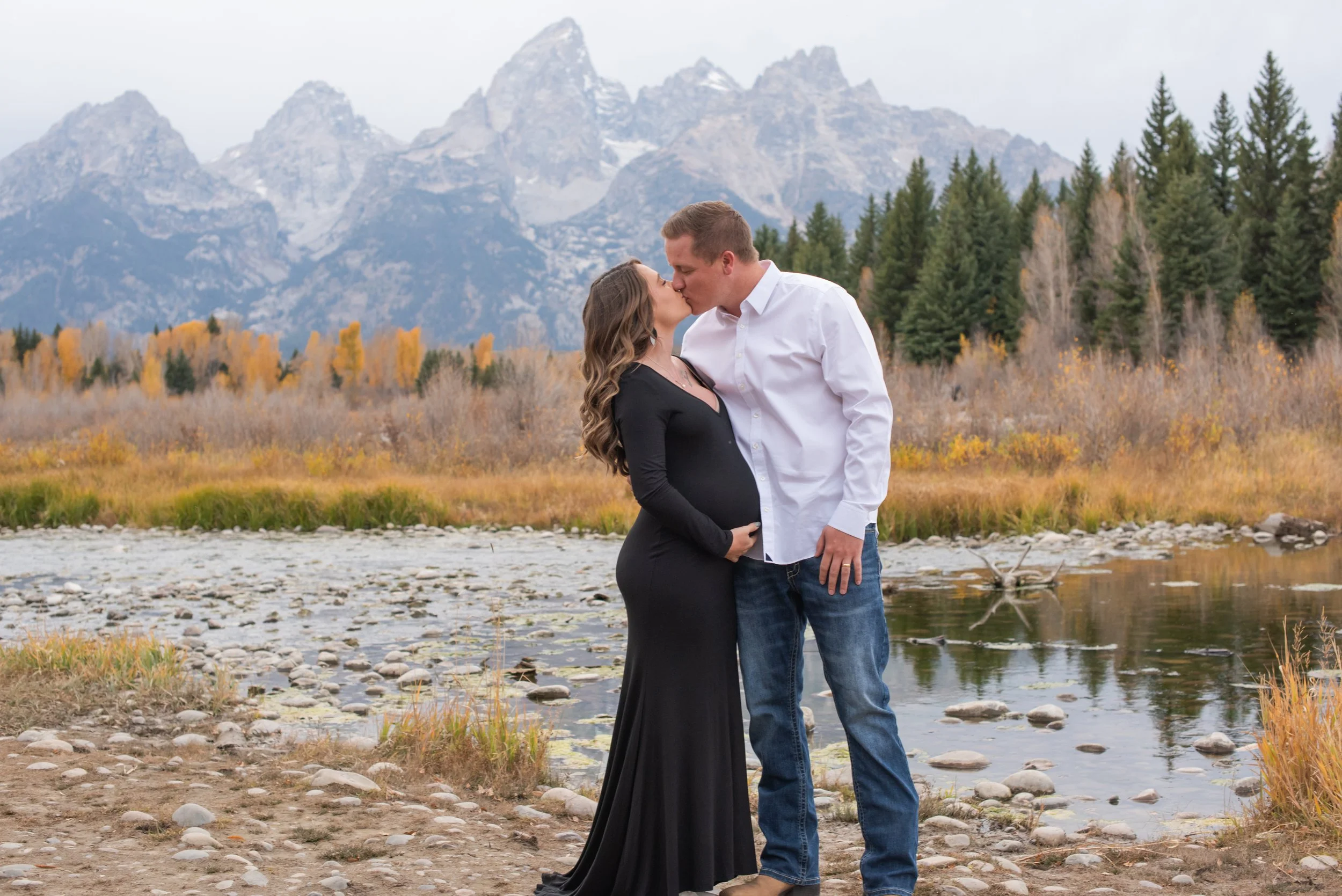 couples kissing in front of the changing aspens in grand tonal patrk