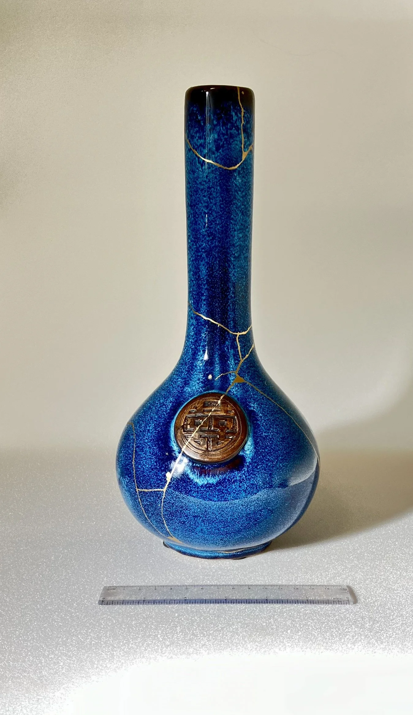 Kintsugi repair on speckle blue vase_front.JPEG