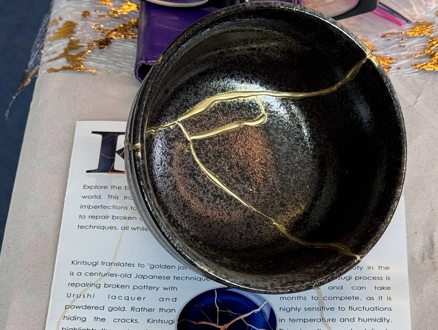 Black bowl with Kintsugi repair.JPG