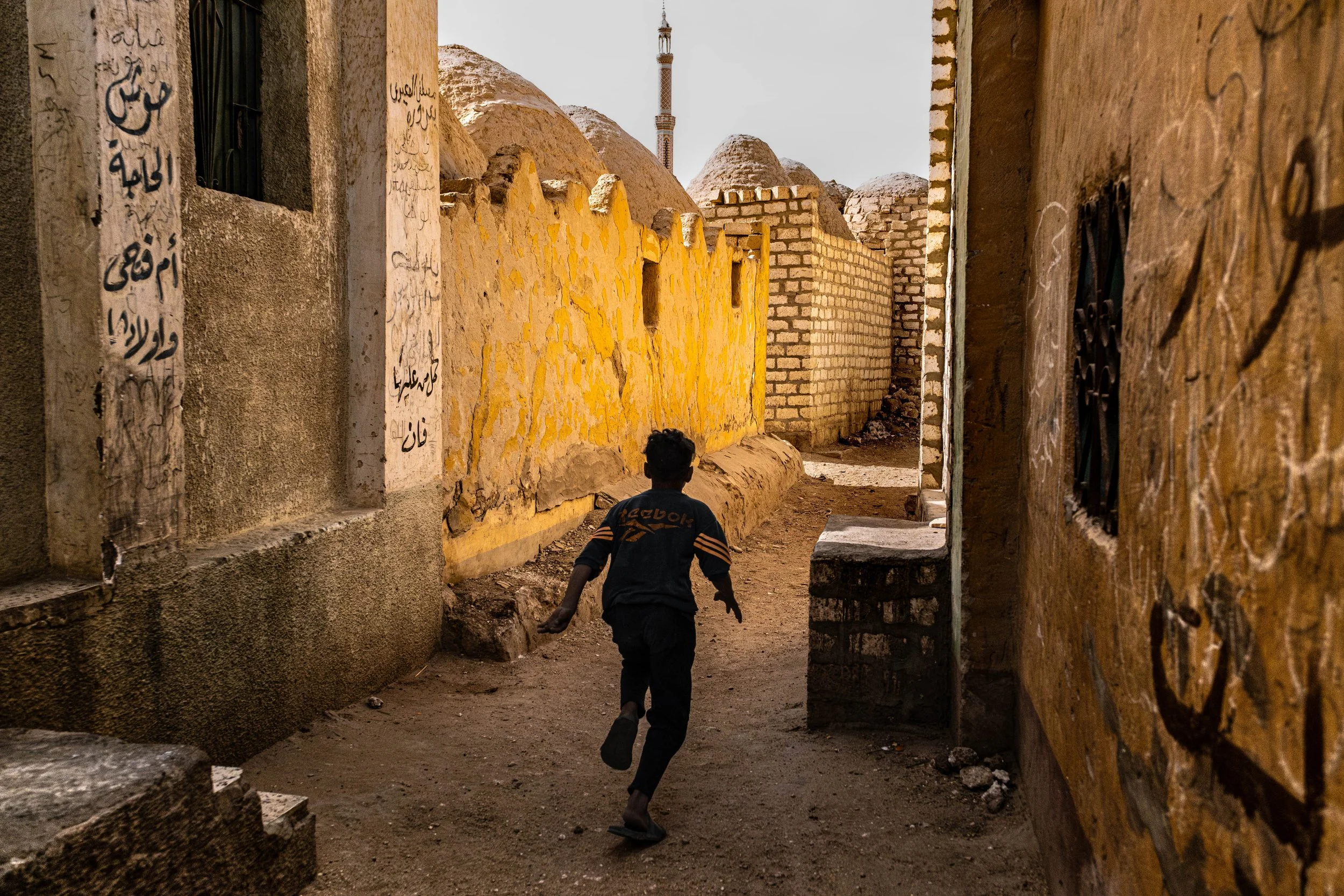 Child playing in an Egyptian graveyard.jpg