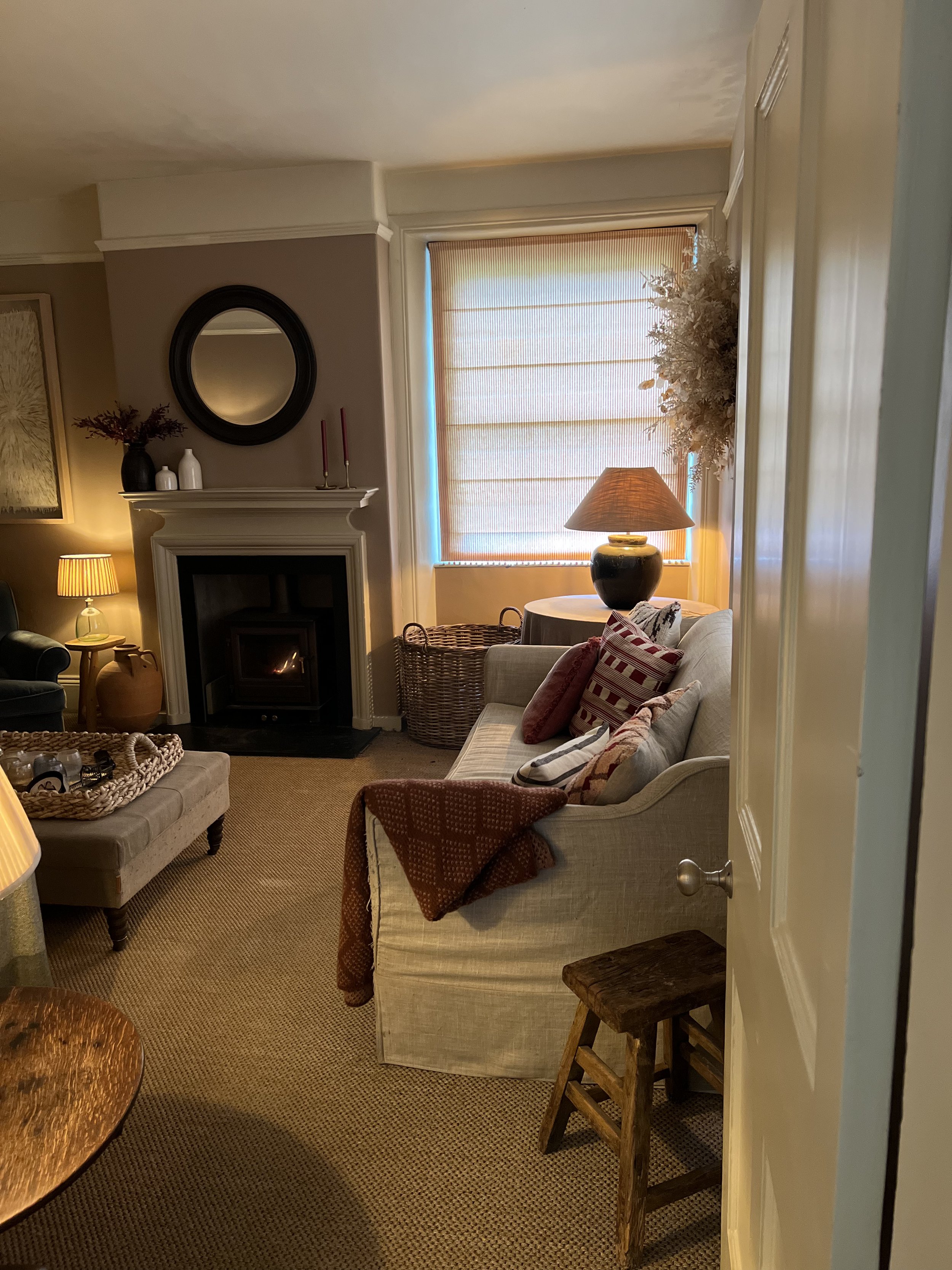 Interior design for a Cotswold country house with warm timber floors, soft linen upholstery and a relaxed rural aesthetic