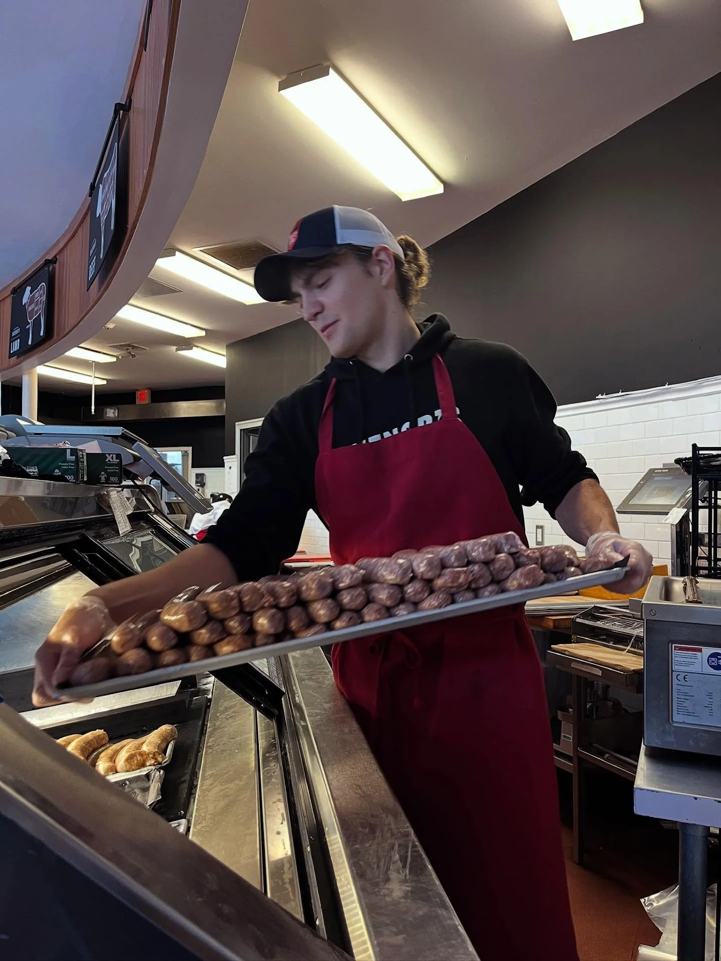 Declan, our butchery apprentice, loads a new batch of house-made sausages into the case. We make our Berkshire pork sausages in a rotating selection of varieties. 

Packed with flavor, they&rsquo;re great to have on hand for when you want to deepen t