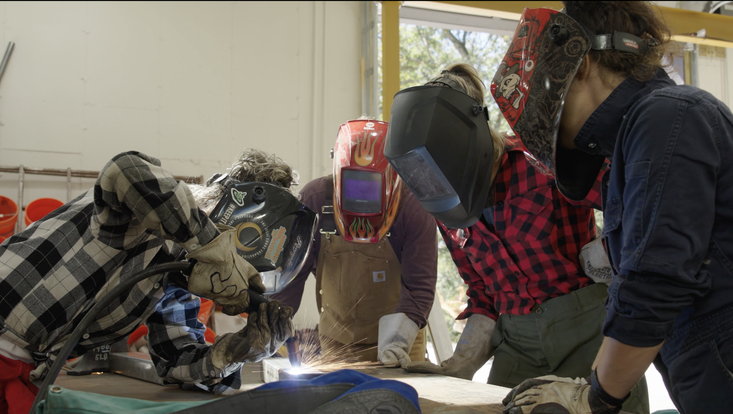 Artists-in-residence welding a metal sculpture inside the studio at 20 Manor estate, Westchester County, Upstate New York, near New York City