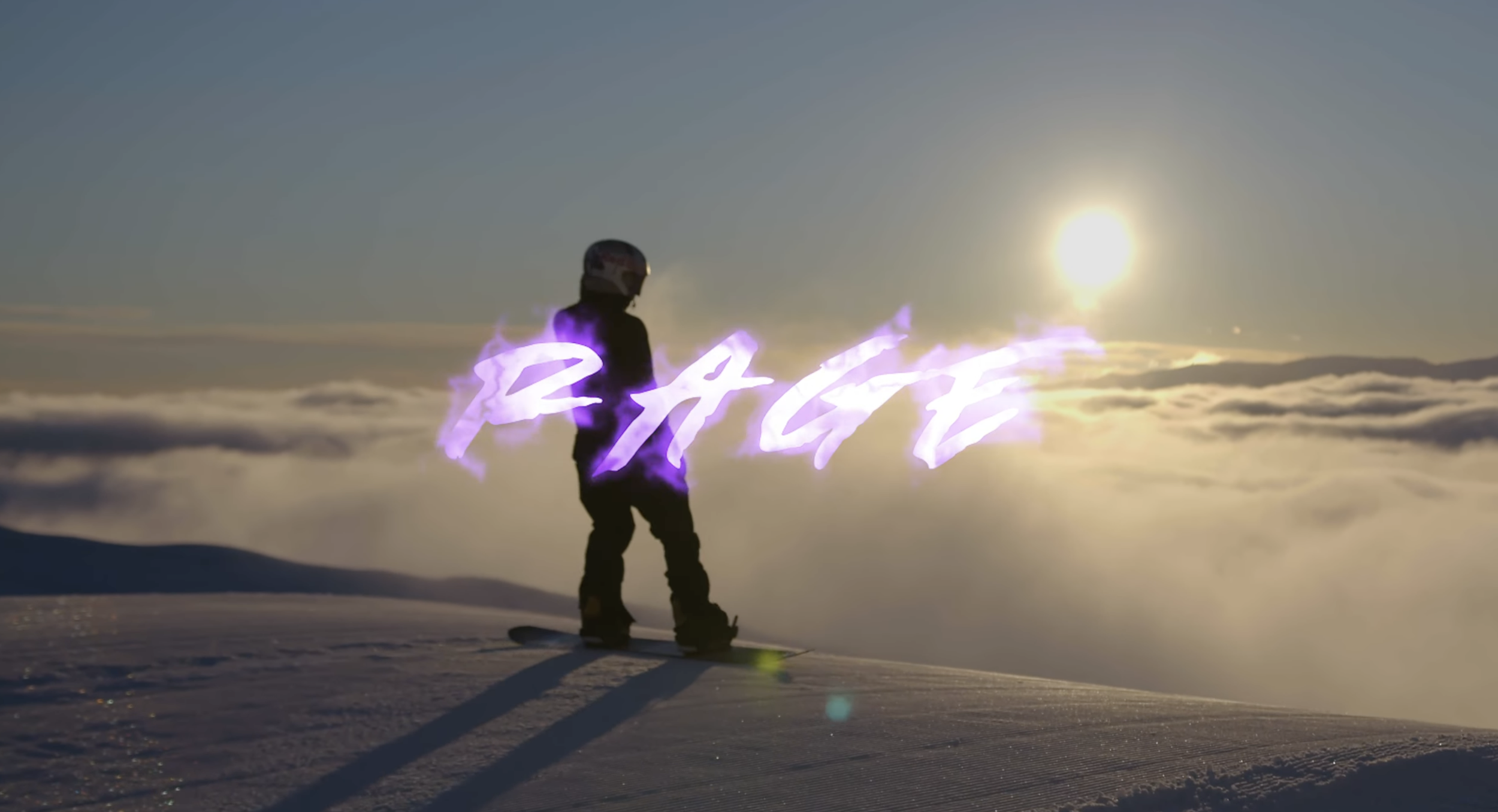 A person standing on snow-covered terrain at sunset or sunrise, with the word 'RACE' in glowing purple letters and a helmet on, against a sky with clouds.