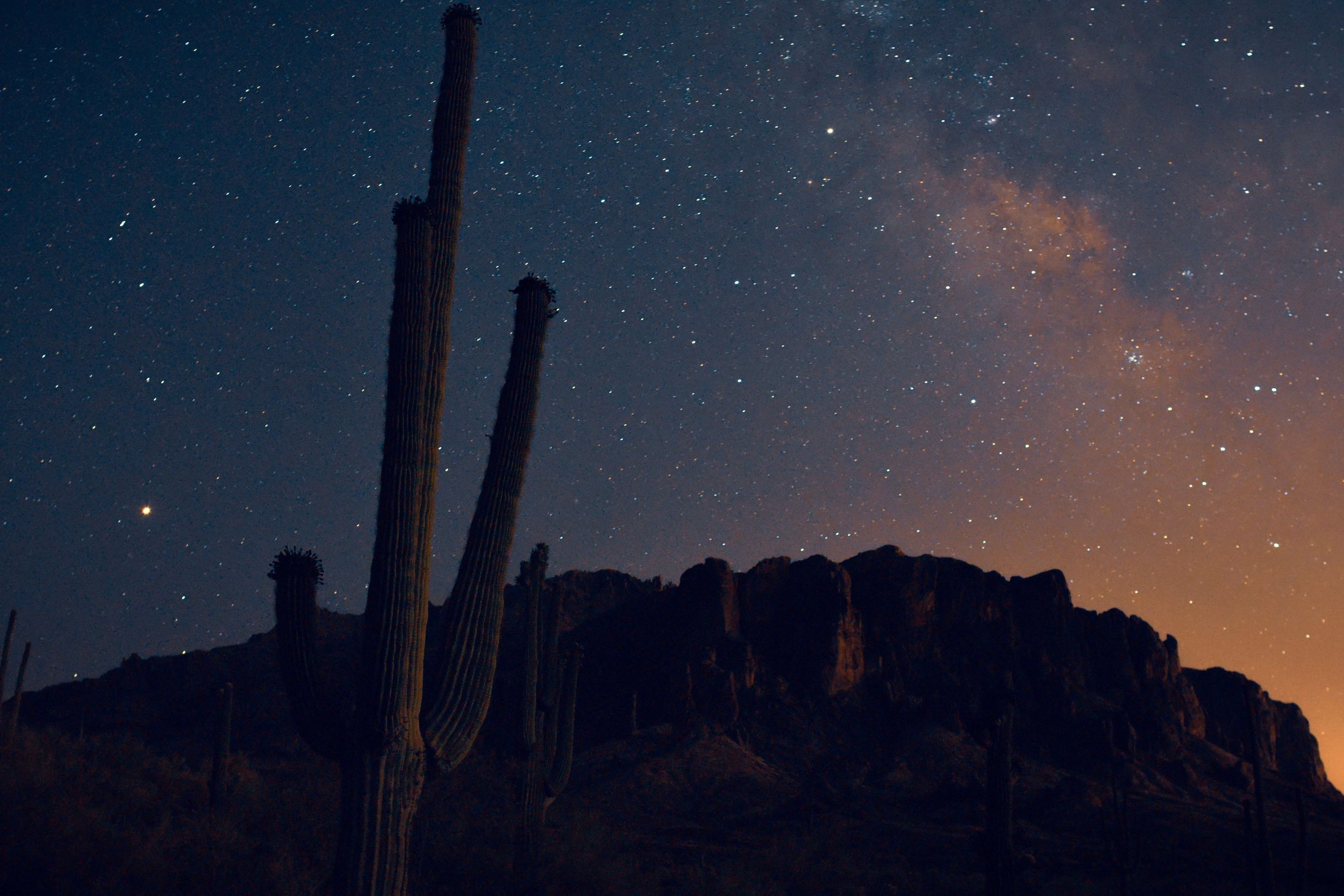 Starry night, milky way rises over desert landscape of the Superstition mountains, saguaro cactus, Gold Canyon, Apache Junction, Arizona, USA, desert, desertscape, hiking, Flat Iron hiking trail, astrophotography, American southwest.