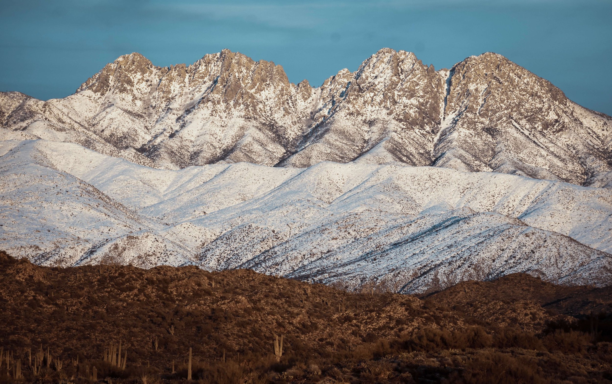 Sunset on the Four Peaks mountains covered in snow after a desert snowstorm, Arizona, USA, 4 peaks, desert, saguaro cactus, cacti, desertscape, Beeline Highways, US Highway 89 AZ, American Southwest.