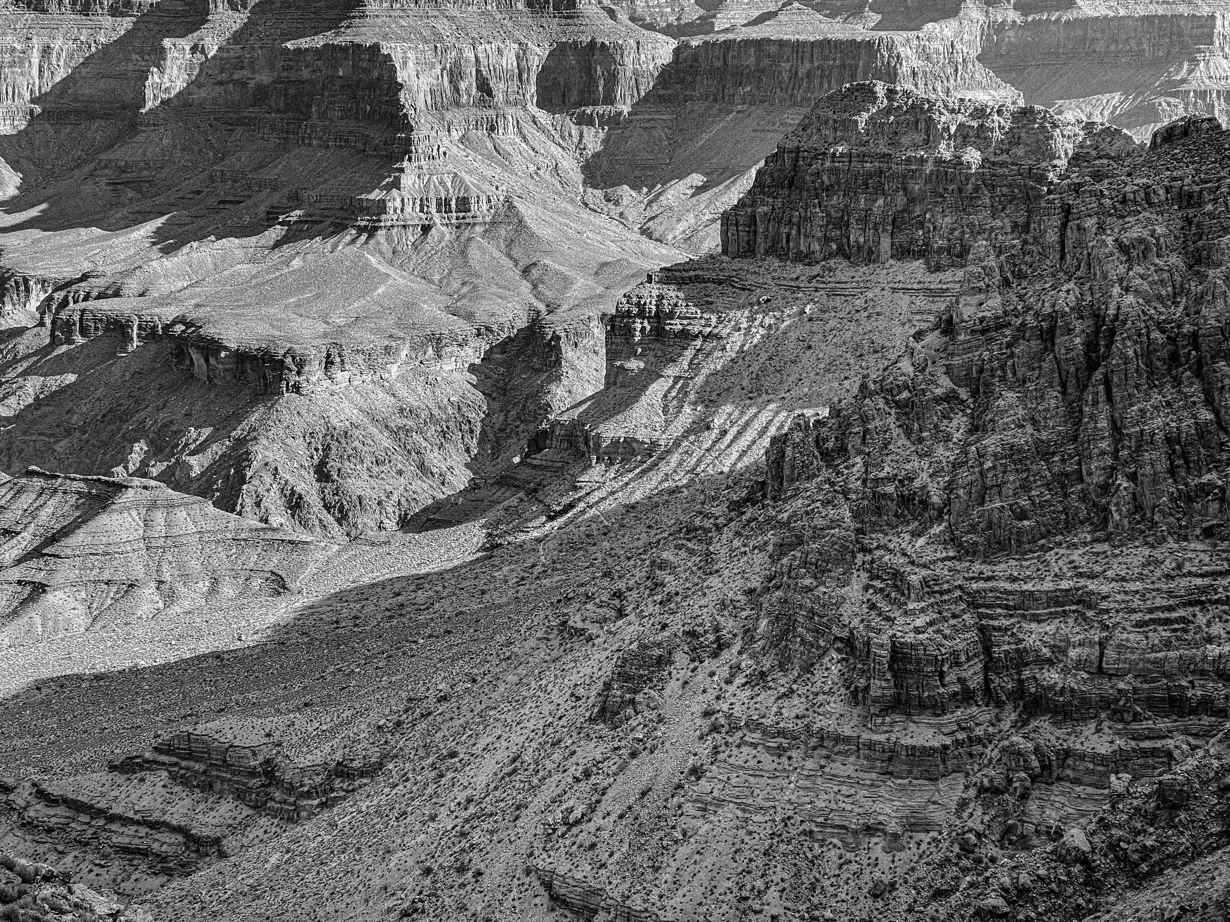 Black and white canyon photo of shadowed canyon layers of the Hermit Rapids Trail, Grand Canyon, Arizona, USA, south rim, backpacking, Hermit Rapids Trail, Grand Canyon National Park, Colorado River, desert, wonders of the world, hiking, canyon layer