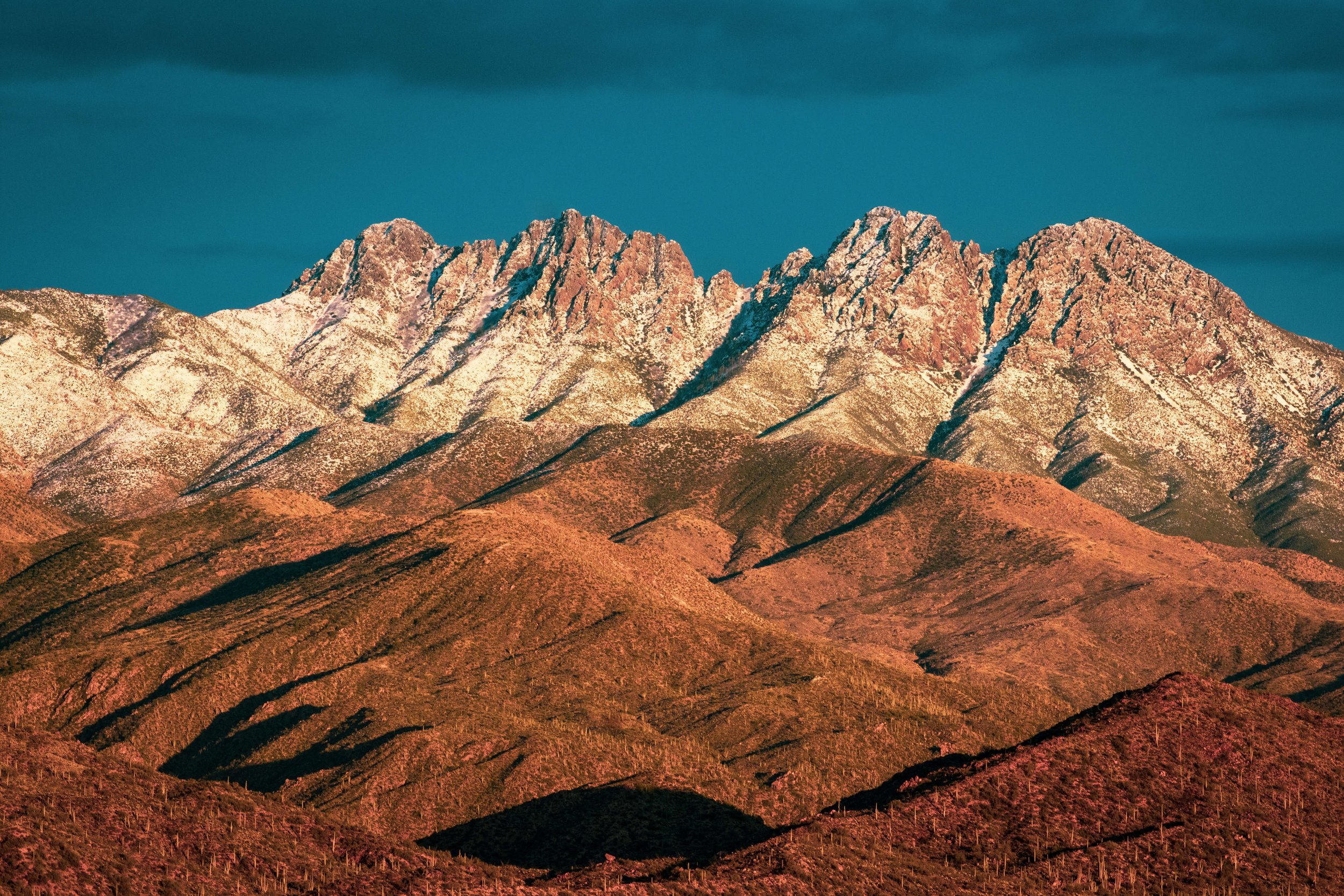 Sunset on the Four Peaks mountains covered in snow after a desert snowstorm, Arizona, USA, 4 peaks, desert, saguaro cactus, cacti, desertscape, Beeline Highways, US Highway 89 AZ, American Southwest.