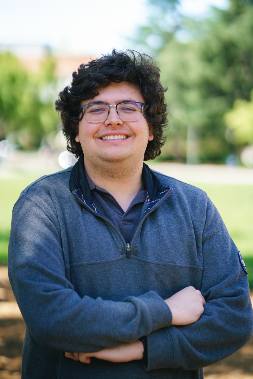 Ben Rose, Graduate Student, on a beach
