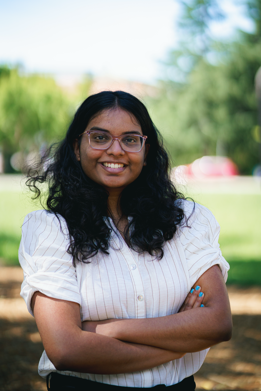 Kithmini Herath, Graduate Student on a boat wearing sunglasses