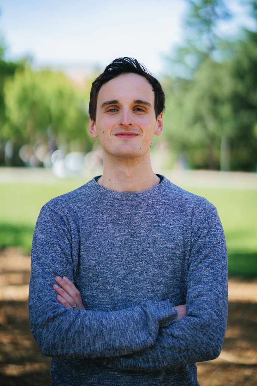 Josh Dickerson, PhD, Post-doctoral fellow punting a boat