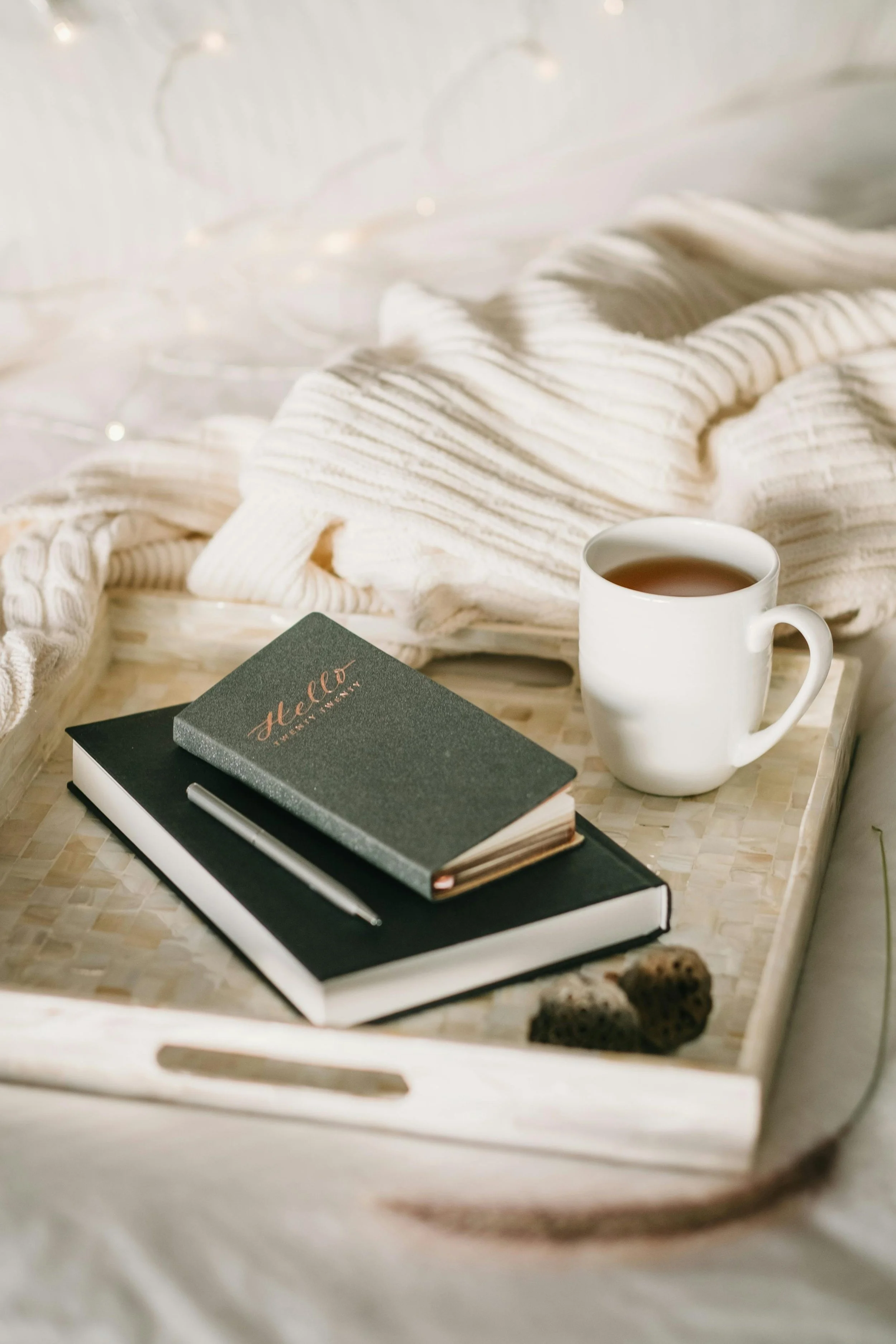 "Journal, tea, and cozy blanket representing the Chaos Untangled® philosophy of intentional living, reflection, and creating calm from chaos."