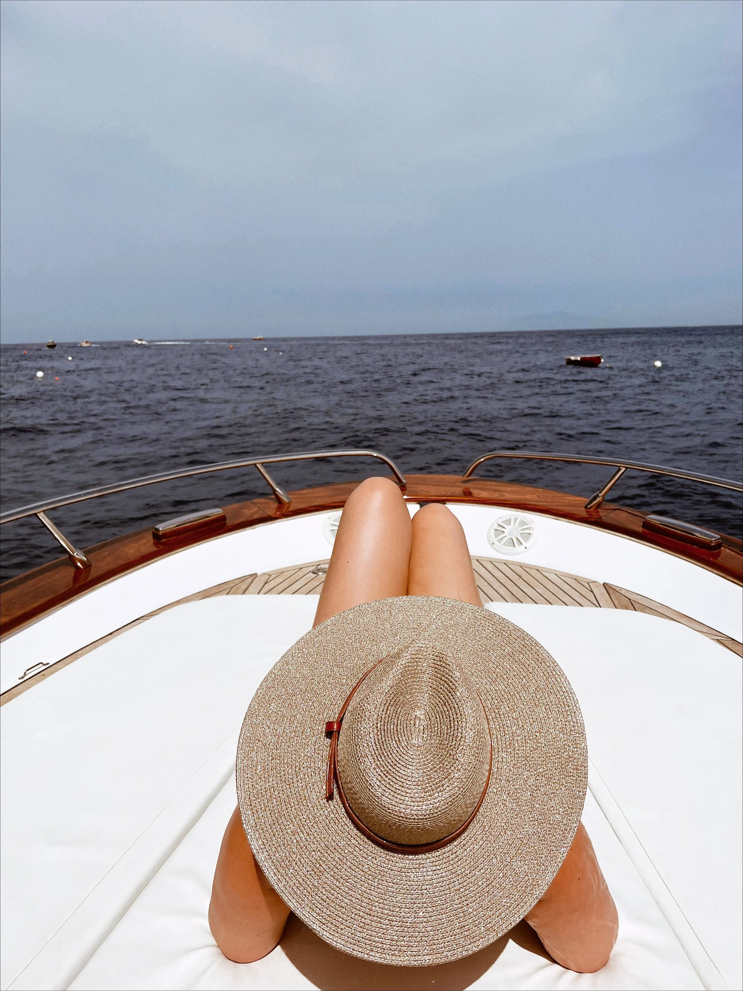 “Yacht owner relaxing on luxury vessel in Stuart Florida after marine interior reset and pre-arrival preparation.”