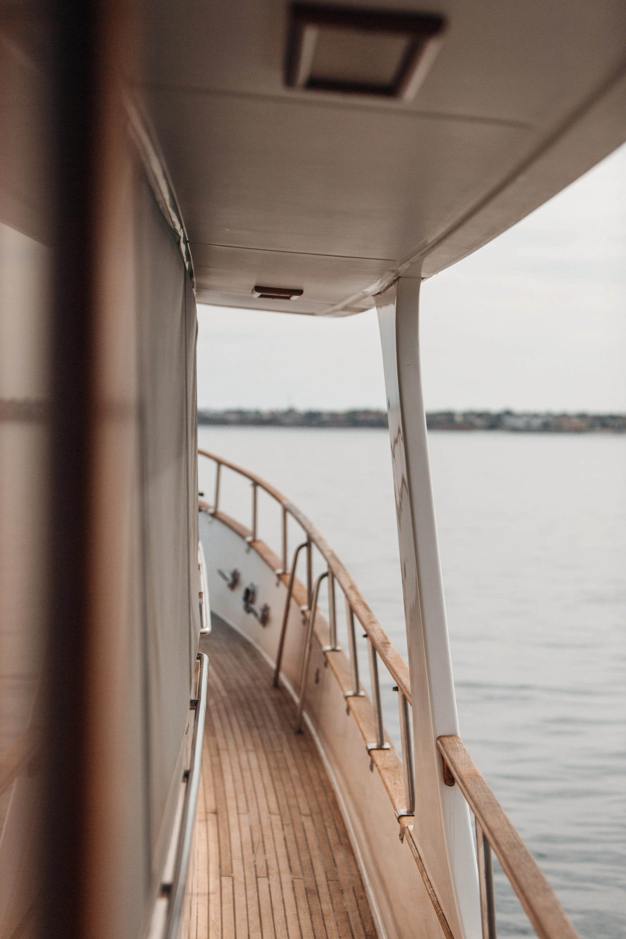 “Luxury yacht walkway with teak decking prepared for owner arrival in Stuart Florida marina.”