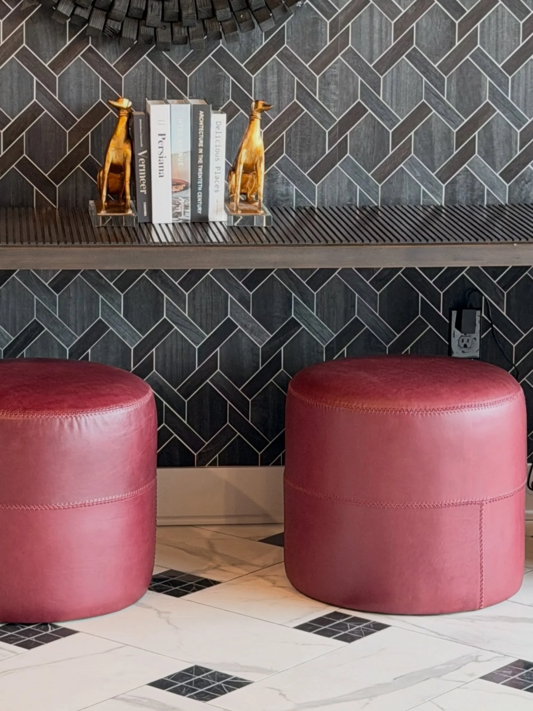What&rsquo;s black and white and red all over? These Italian red leather stools that were just delivered for our leasing office foyer 👀😮&zwj;💨