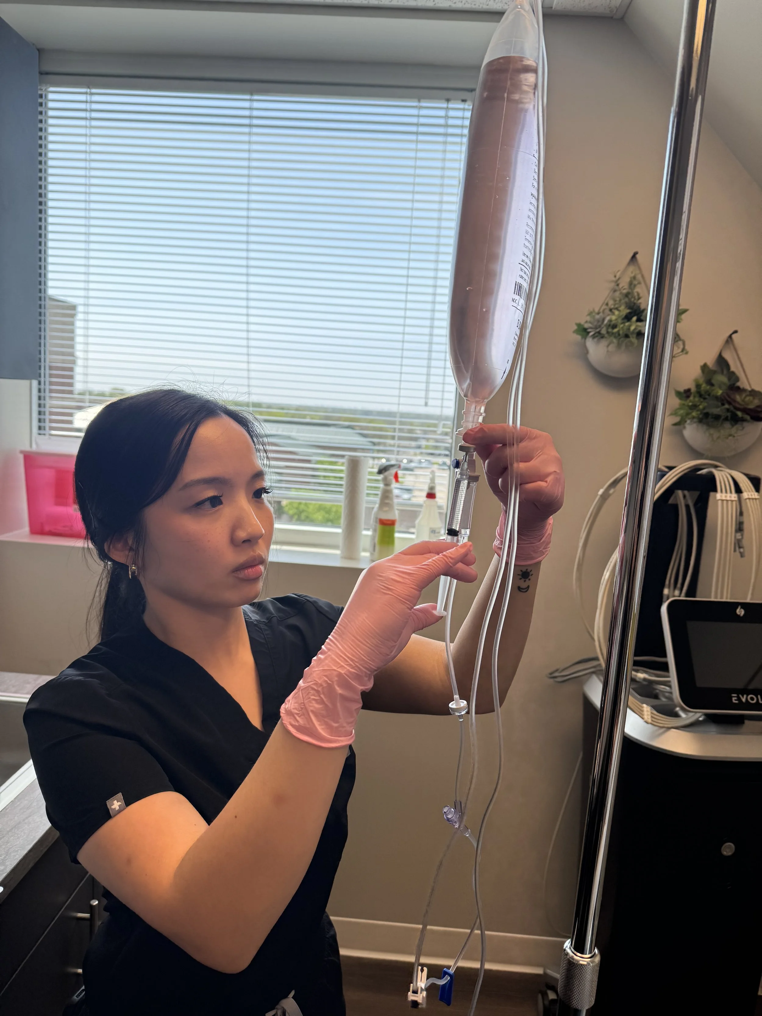 Physician Assistant preparing iv infusion therapy