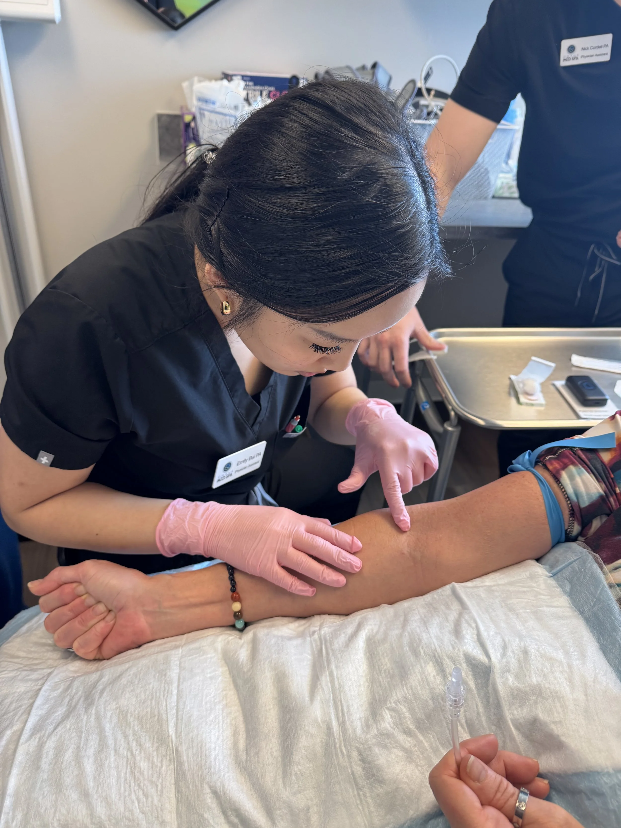 Physician Assistant preparing to start an iv for infusion