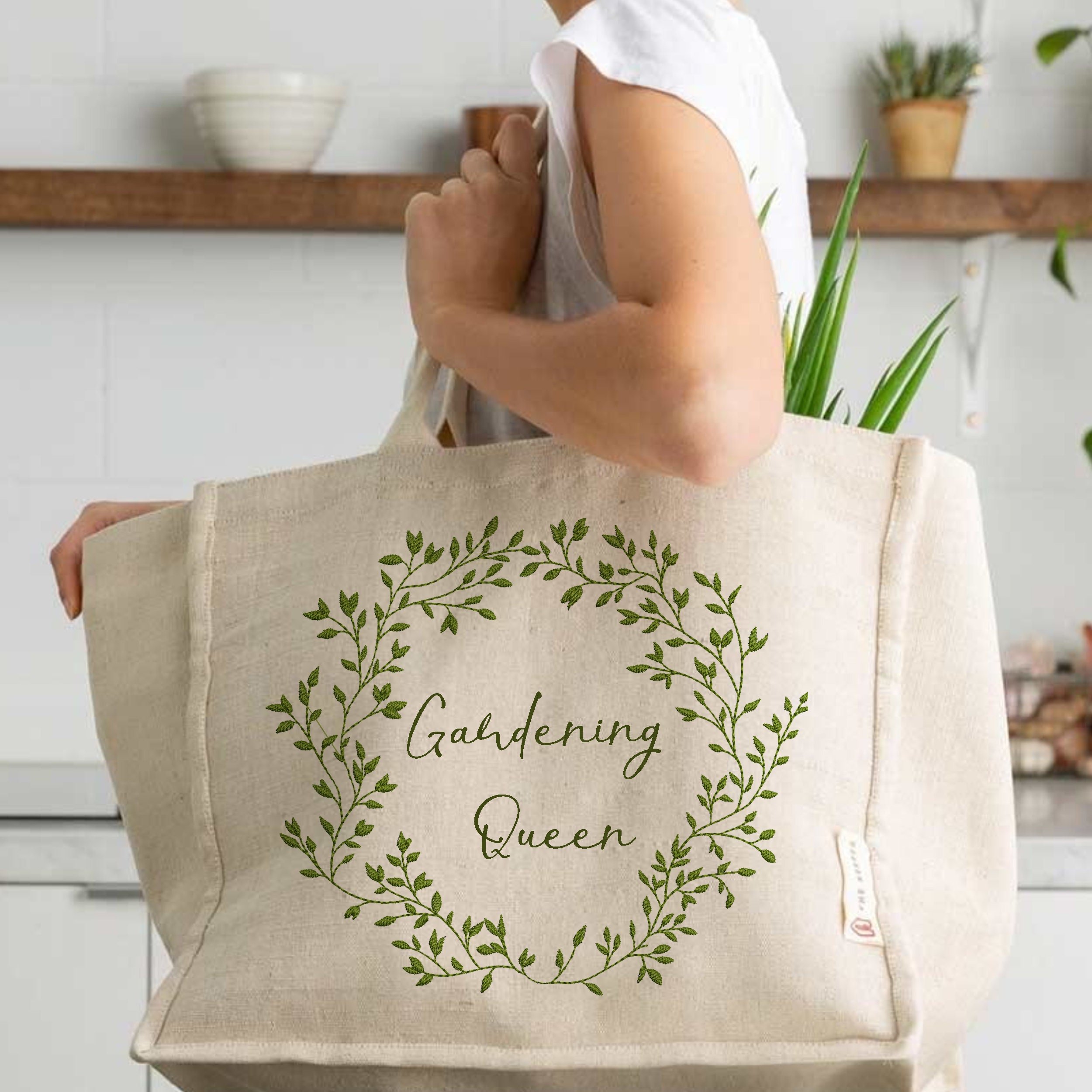 Rich Greenery Wreath and Border Machine Embroidery Design embroidered on a handbag