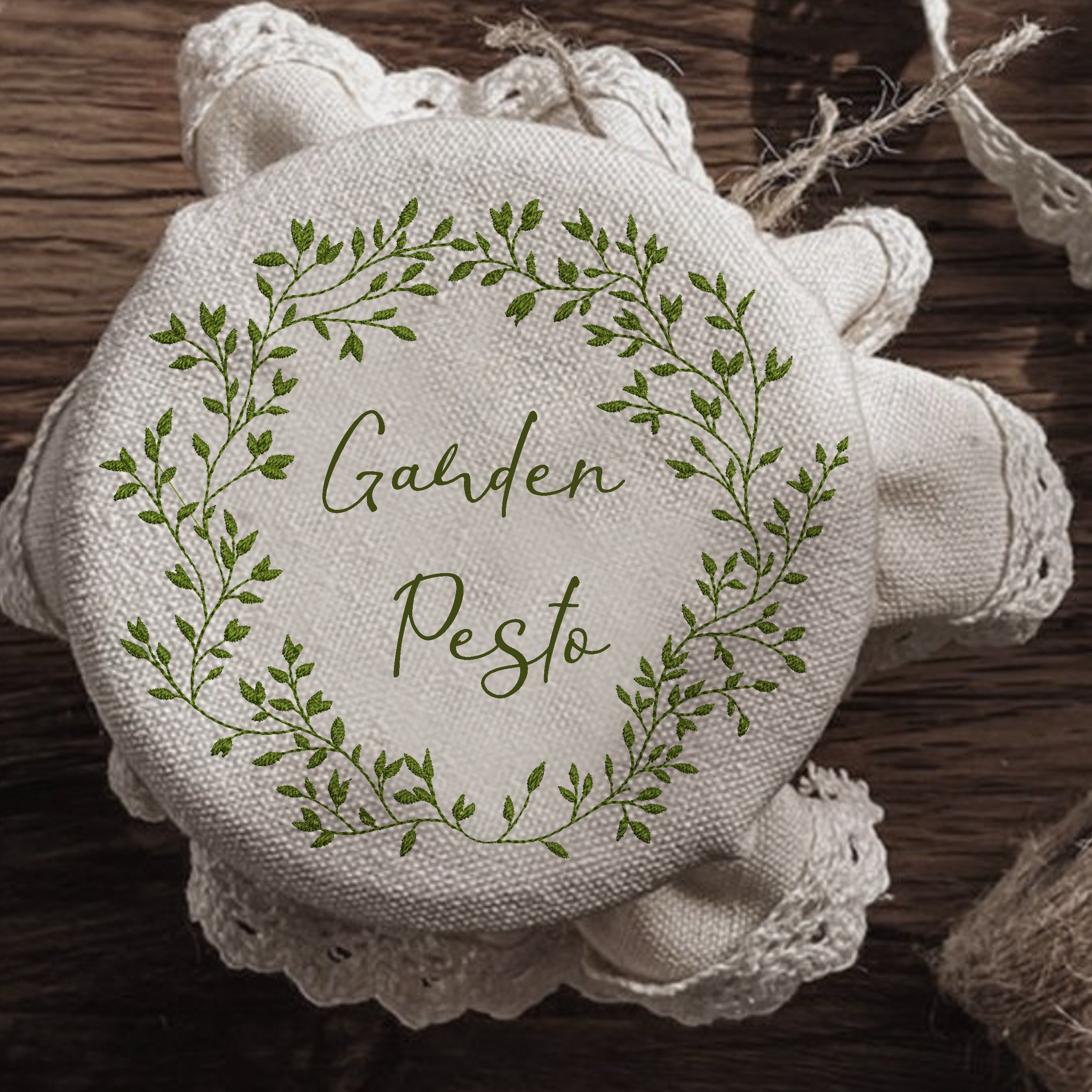 Rich Greenery Wreath and Border Machine Embroidery Design embroidered on a jam jar pillow